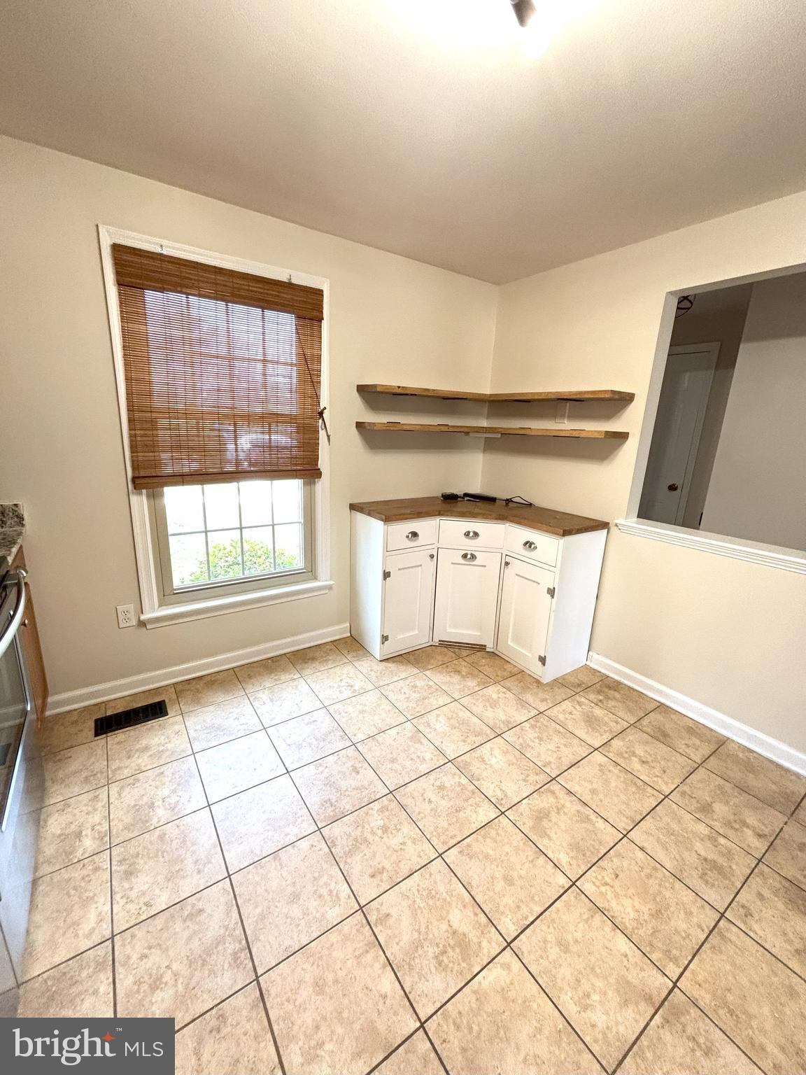 8220 Red Wing Court Frederick, MD 21701 - Photo 3 of 17 a view of empty room with wooden floor and cabinet