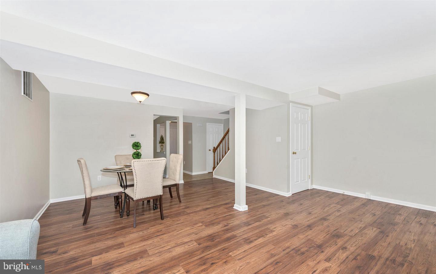8220 Red Wing Court Frederick, MD 21701 - Photo 6 of 17 a dining room with furniture and wooden floor