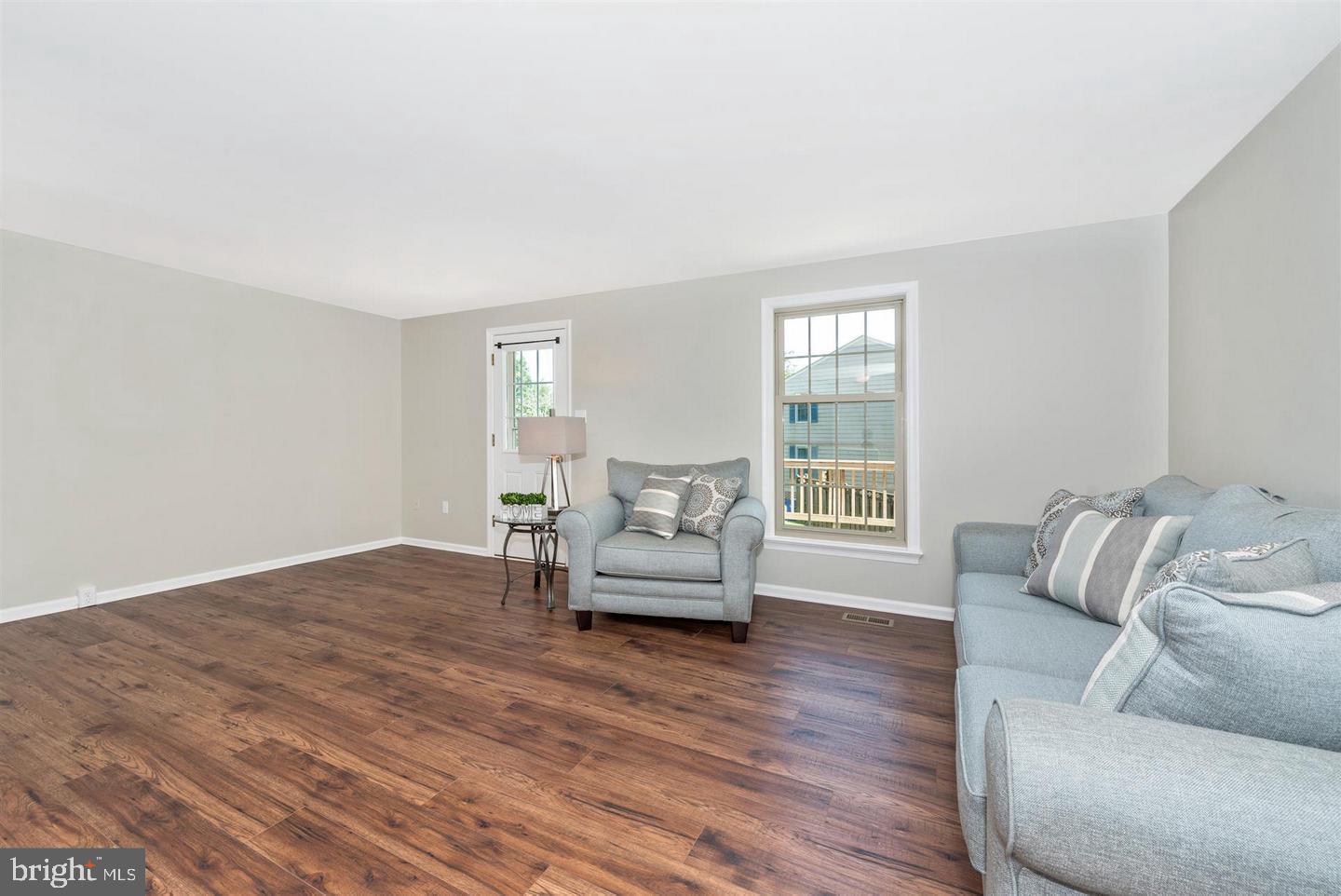 8220 Red Wing Court Frederick, MD 21701 - Photo 7 of 17 a living room with furniture and a wooden floor