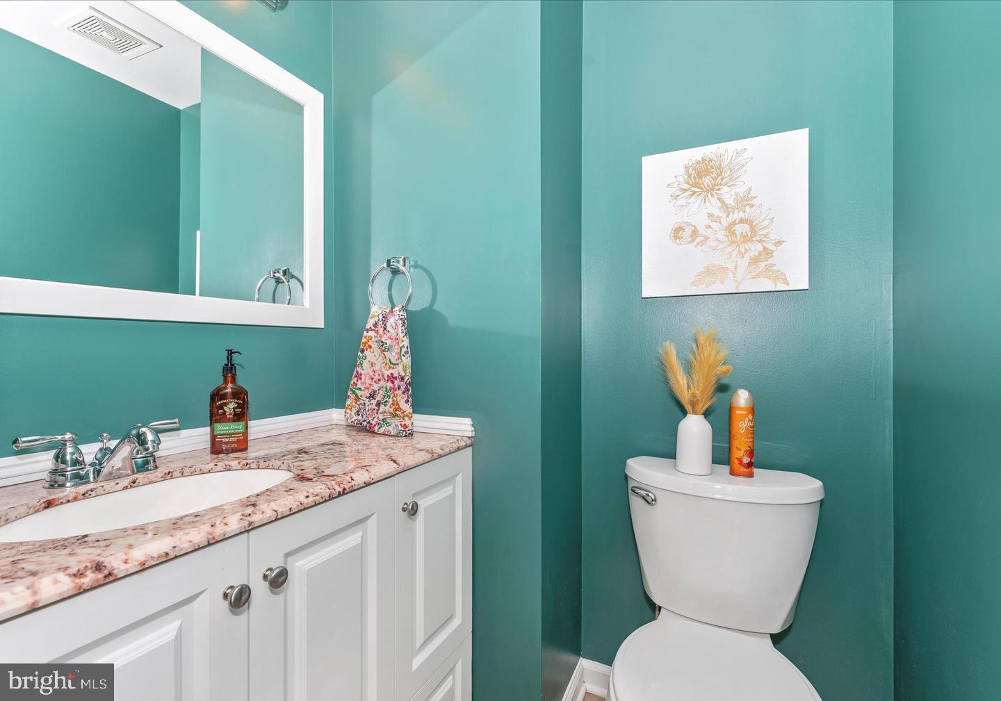 8220 Red Wing Court Frederick, MD 21701 - Photo 8 of 17 a bathroom with a toilet sink and mirror