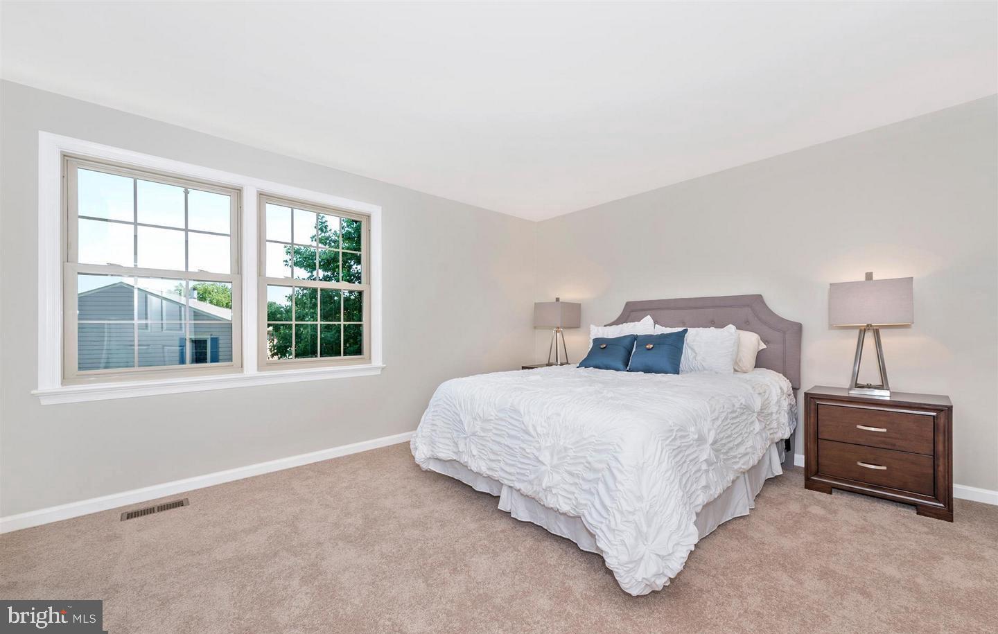 8220 Red Wing Court Frederick, MD 21701 - Photo 10 of 17 a spacious bedroom with a bed and a window