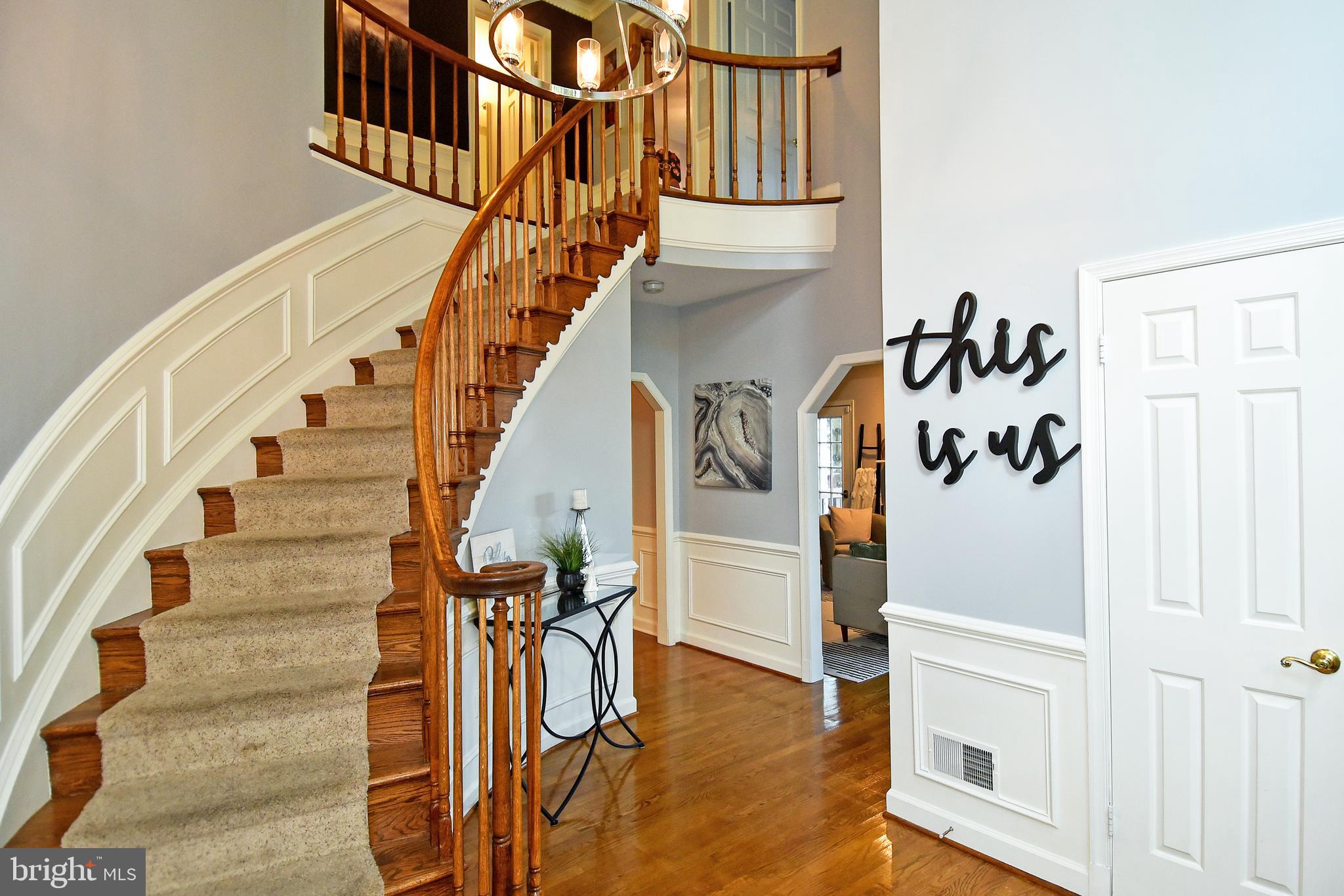 STAIRWELL TO UPPER LEVEL  RIGHT DOOR POWDER ROOM