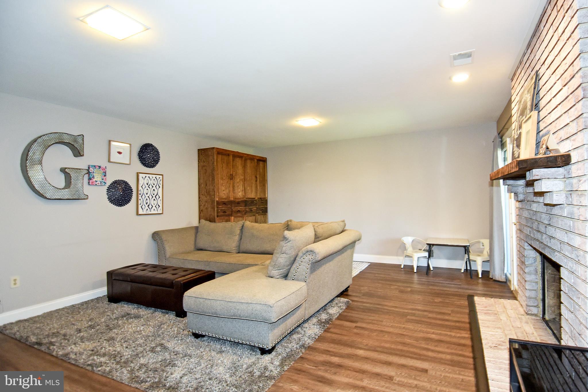2140 Colonel Way Odenton, MD 21113 - Photo 41 of 49 LOWER LEVEL HAS MANTEL ABOVE FIREPLACE