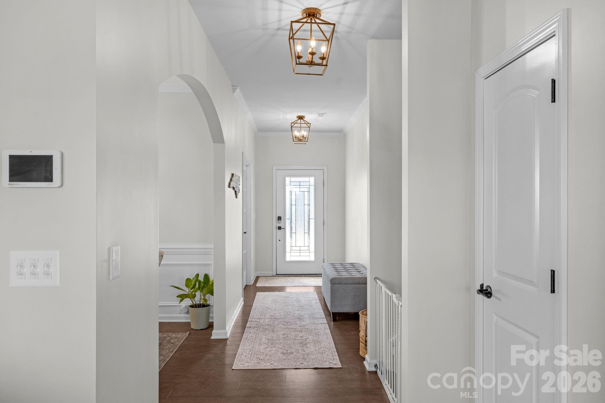 4280 Coachwhip Avenue Lancaster, SC 29720 - Photo 11 of 48 a view of a hallway with wooden floor and glass door