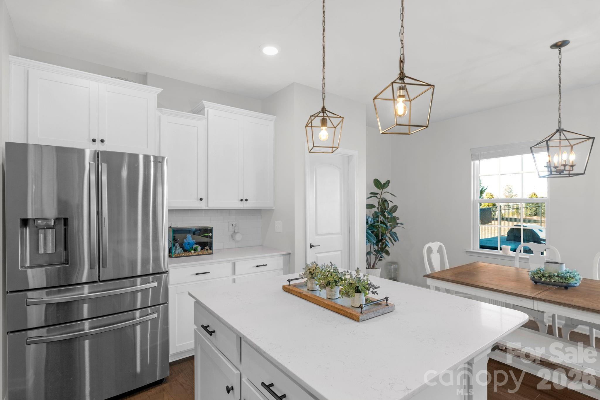 4280 Coachwhip Avenue Lancaster, SC 29720 - Photo 18 of 48 a kitchen with stainless steel appliances a sink a stove a refrigerator and cabinets