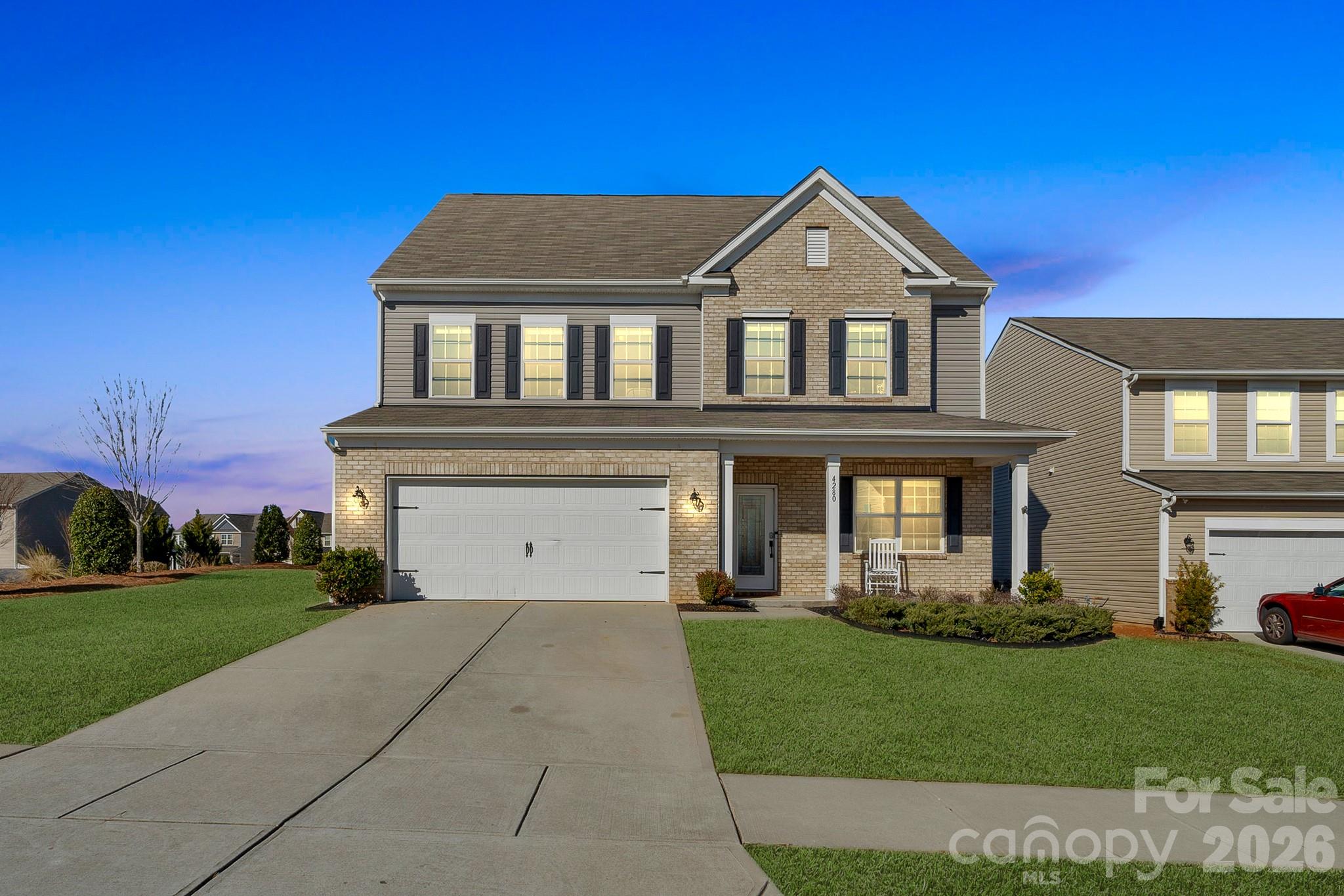 4280 Coachwhip Avenue Lancaster, SC 29720 - Photo 2 of 48 a front view of a house with a yard and garage