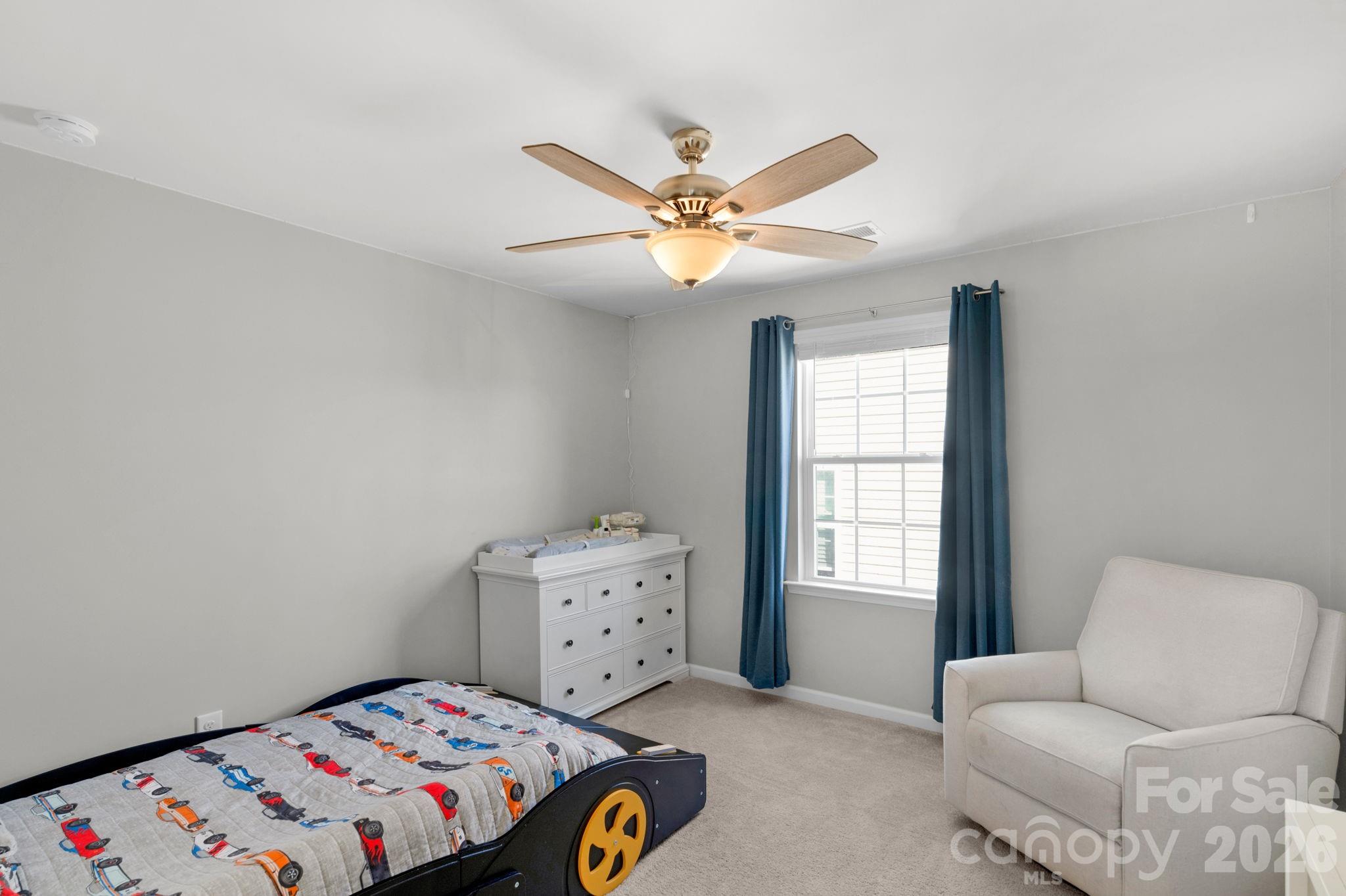 4280 Coachwhip Avenue Lancaster, SC 29720 - Photo 26 of 48 a bedroom with a bed and a chandelier