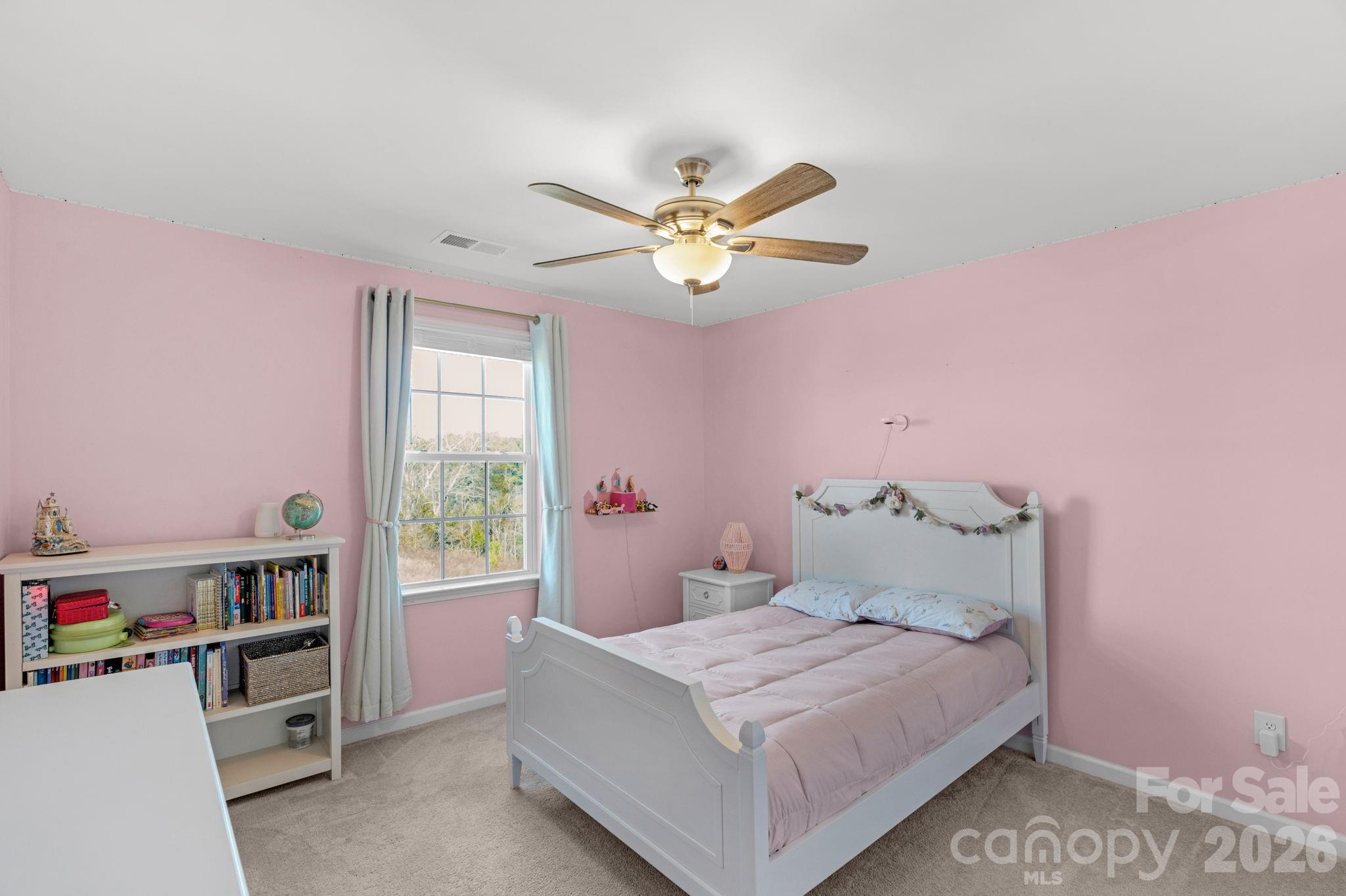 4280 Coachwhip Avenue Lancaster, SC 29720 - Photo 27 of 48 a bedroom with a bed and a book shelf