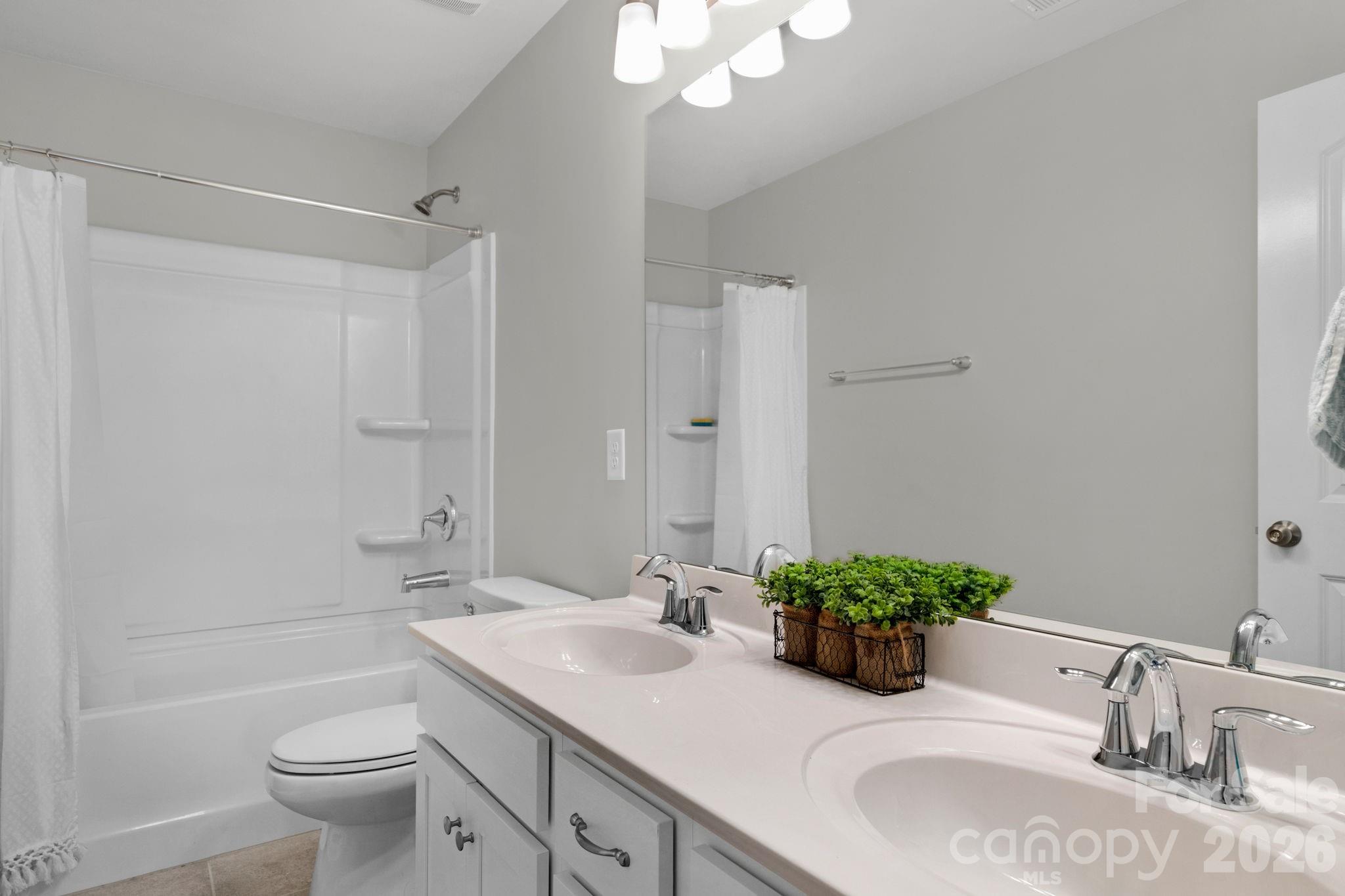 4280 Coachwhip Avenue Lancaster, SC 29720 - Photo 28 of 48 a bathroom with a sink a toilet and shower