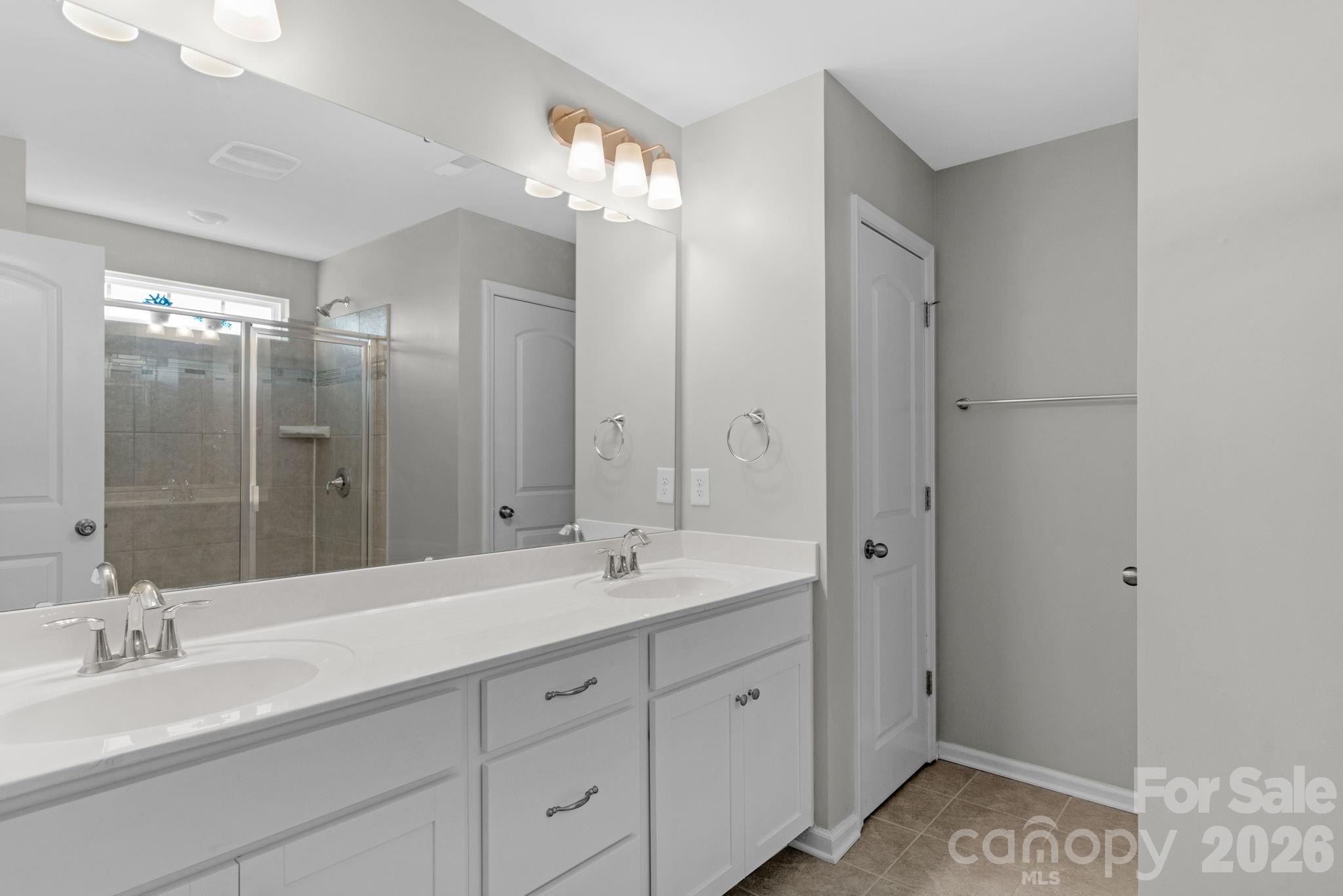 4280 Coachwhip Avenue Lancaster, SC 29720 - Photo 31 of 48 a spacious bathroom with double sink and a mirror