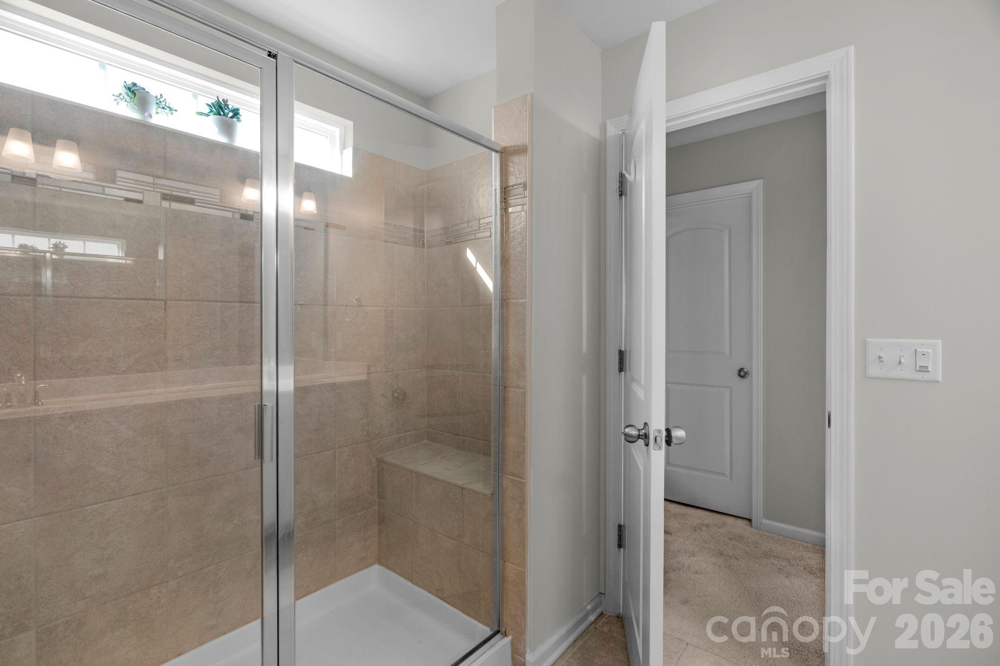 4280 Coachwhip Avenue Lancaster, SC 29720 - Photo 32 of 48 a bathroom with a glass shower door