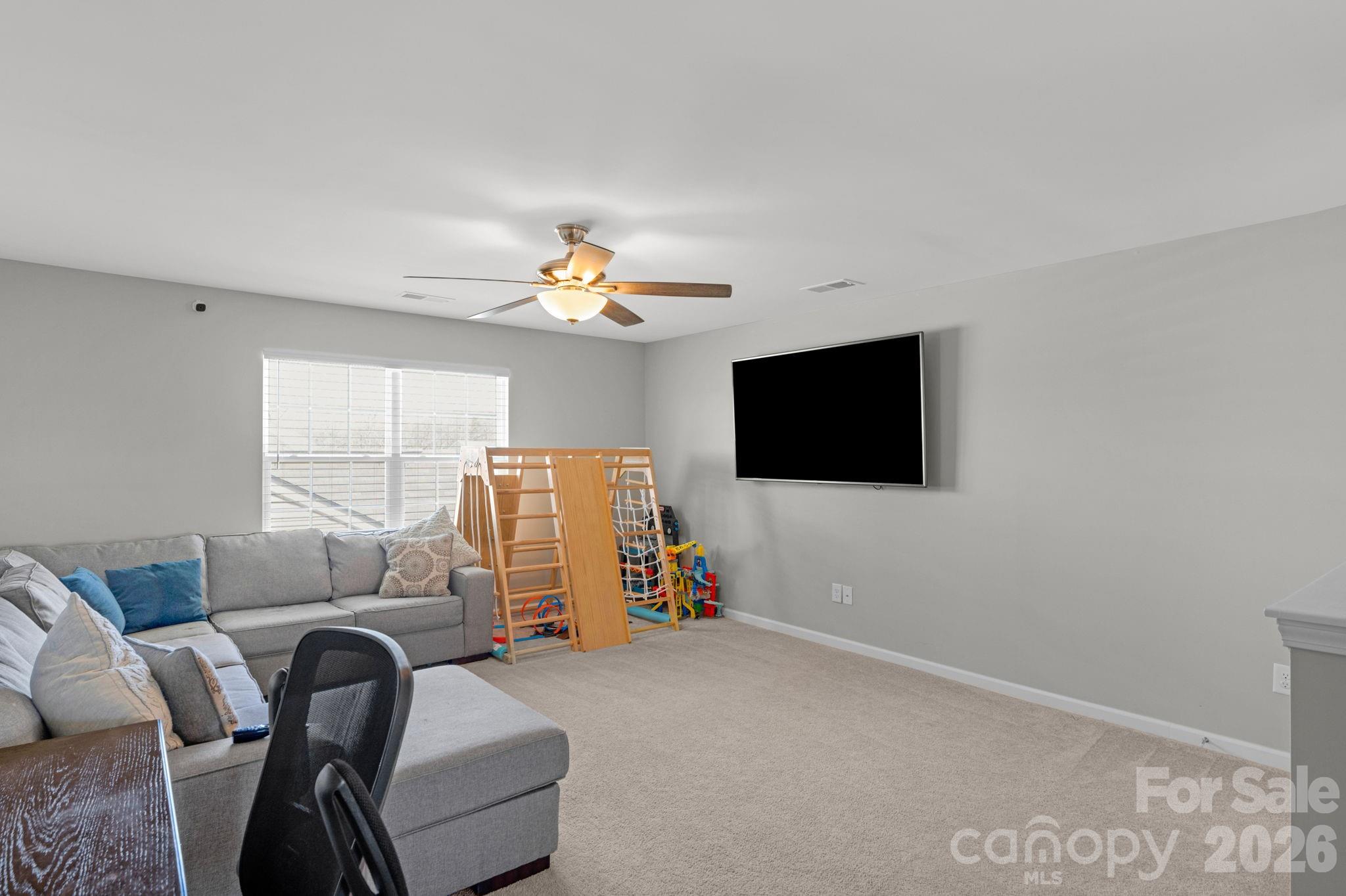 4280 Coachwhip Avenue Lancaster, SC 29720 - Photo 35 of 48 a living room with furniture and a flat screen tv