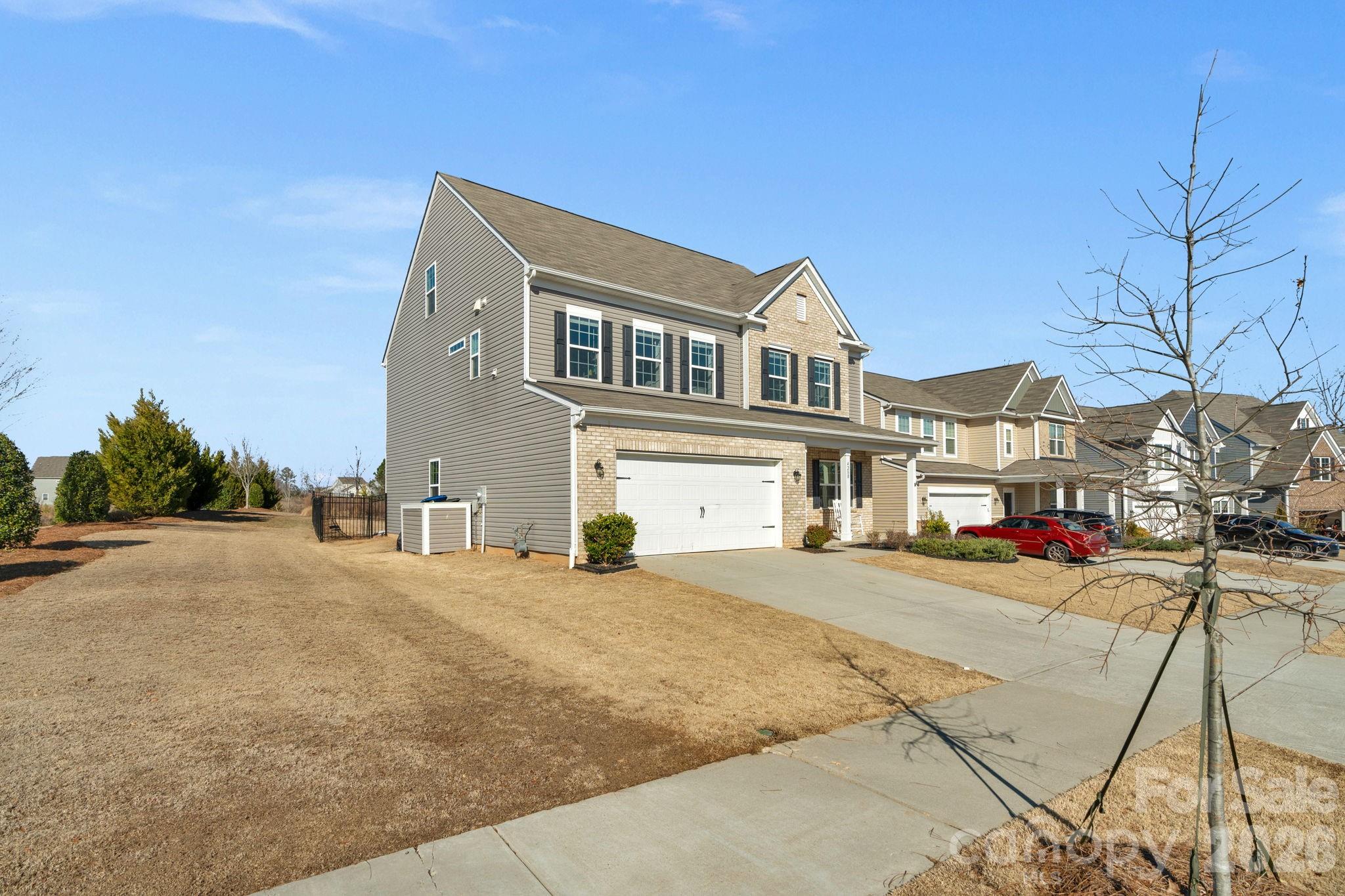 4280 Coachwhip Avenue Lancaster, SC 29720 - Photo 37 of 48 a front view of a house with a yard and garage