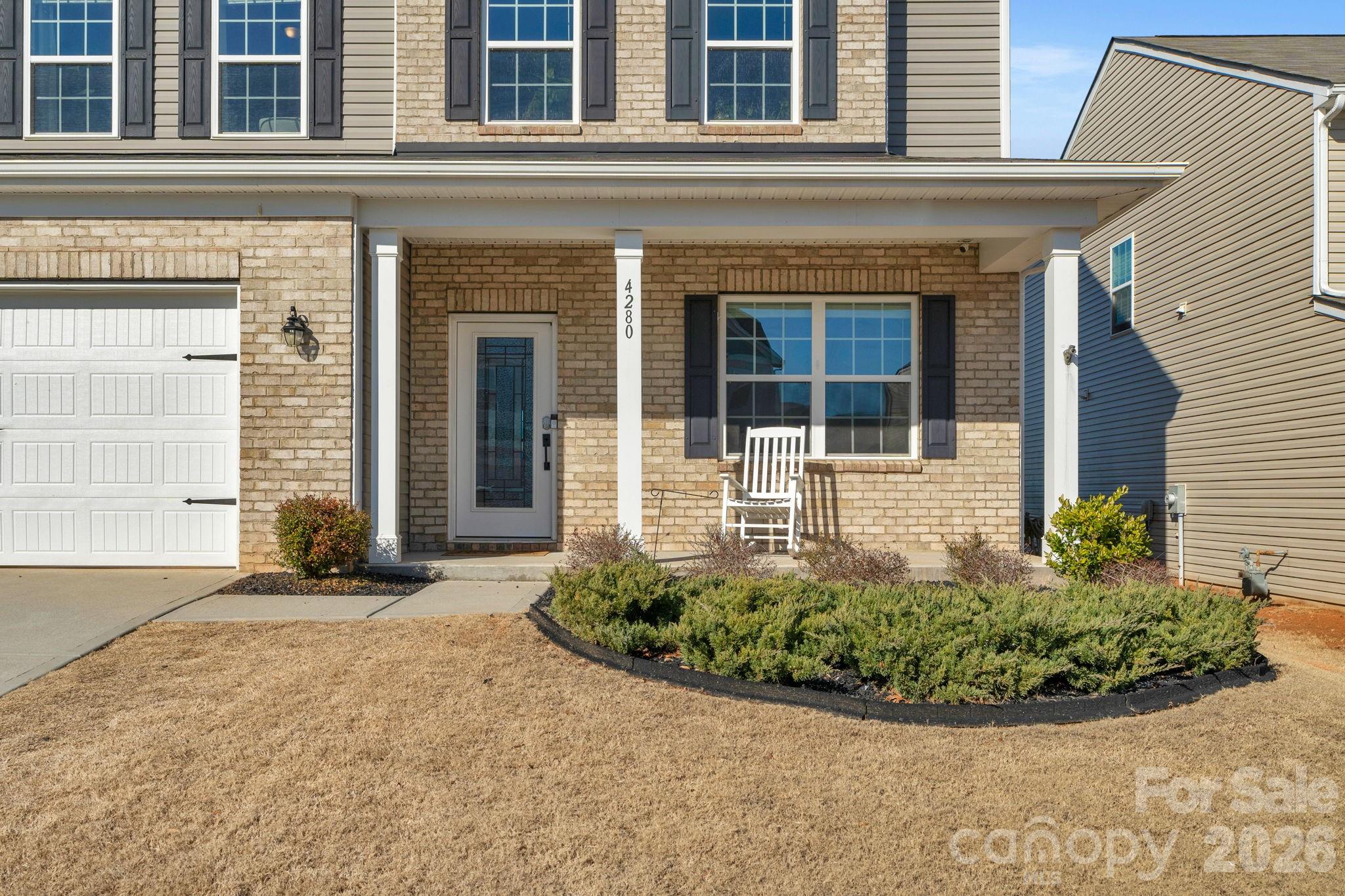 4280 Coachwhip Avenue Lancaster, SC 29720 - Photo 39 of 48 front view of a brick house with potted plants