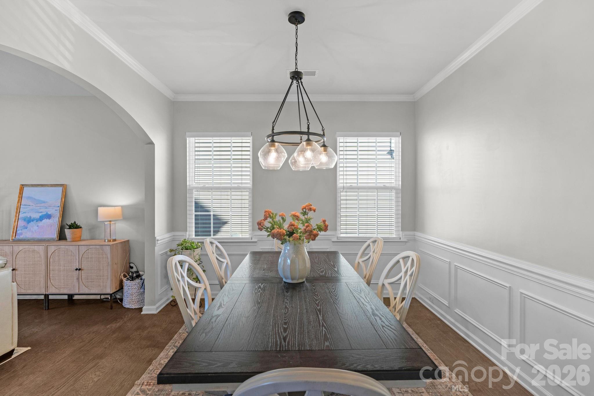 4280 Coachwhip Avenue Lancaster, SC 29720 - Photo 10 of 48 a dining room with furniture potted plants and wooden floor