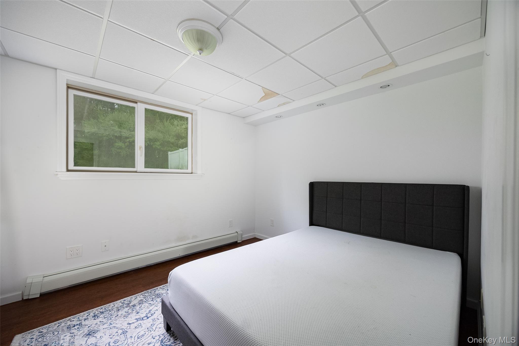 921 West Dover Road Pawling, NY 12564 - Photo 23 of 36 Room featuring wood-finish flooring, white walls, and a drop ceiling