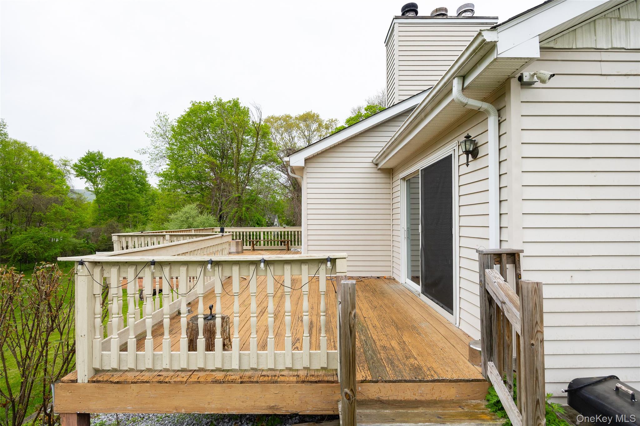 921 West Dover Road Pawling, NY 12564 - Photo 33 of 36 Expansive wood-finish deck with white spindle railing