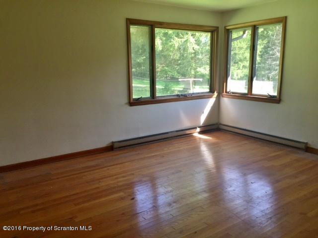1470 Aberdeen Road Moscow, PA 18444 - Photo 3 of 15 a view of room with window and wooden floor