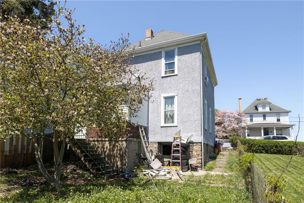 1420 Maple Avenue Monessen, PA 15062 - Photo 6 of 7 a front view of a house with garden