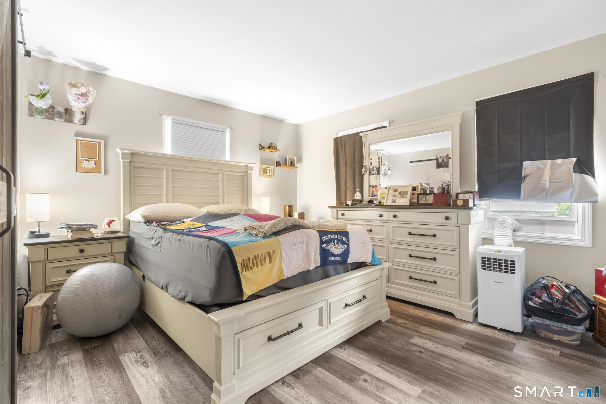 13 Christy Hill Road Ledyard, CT 06335 - Photo 20 of 38 a bedroom with furniture and a flat tv screen