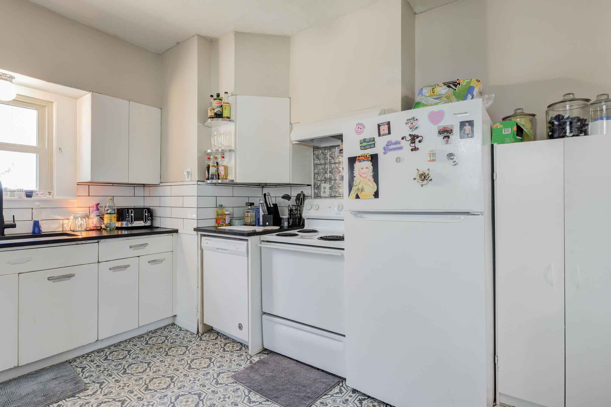 2606 22nd Street Lubbock, TX 79410 - Photo 11 of 24 a white refrigerator freezer sitting inside of a kitchen