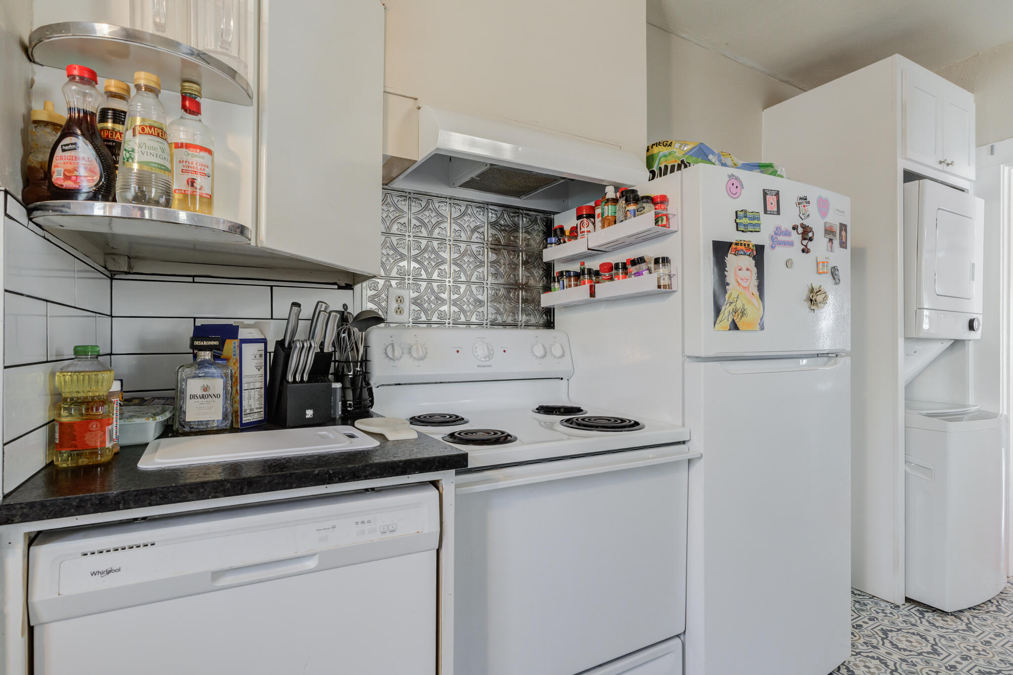 2606 22nd Street Lubbock, TX 79410 - Photo 13 of 24 a kitchen with refrigerator and cabinets