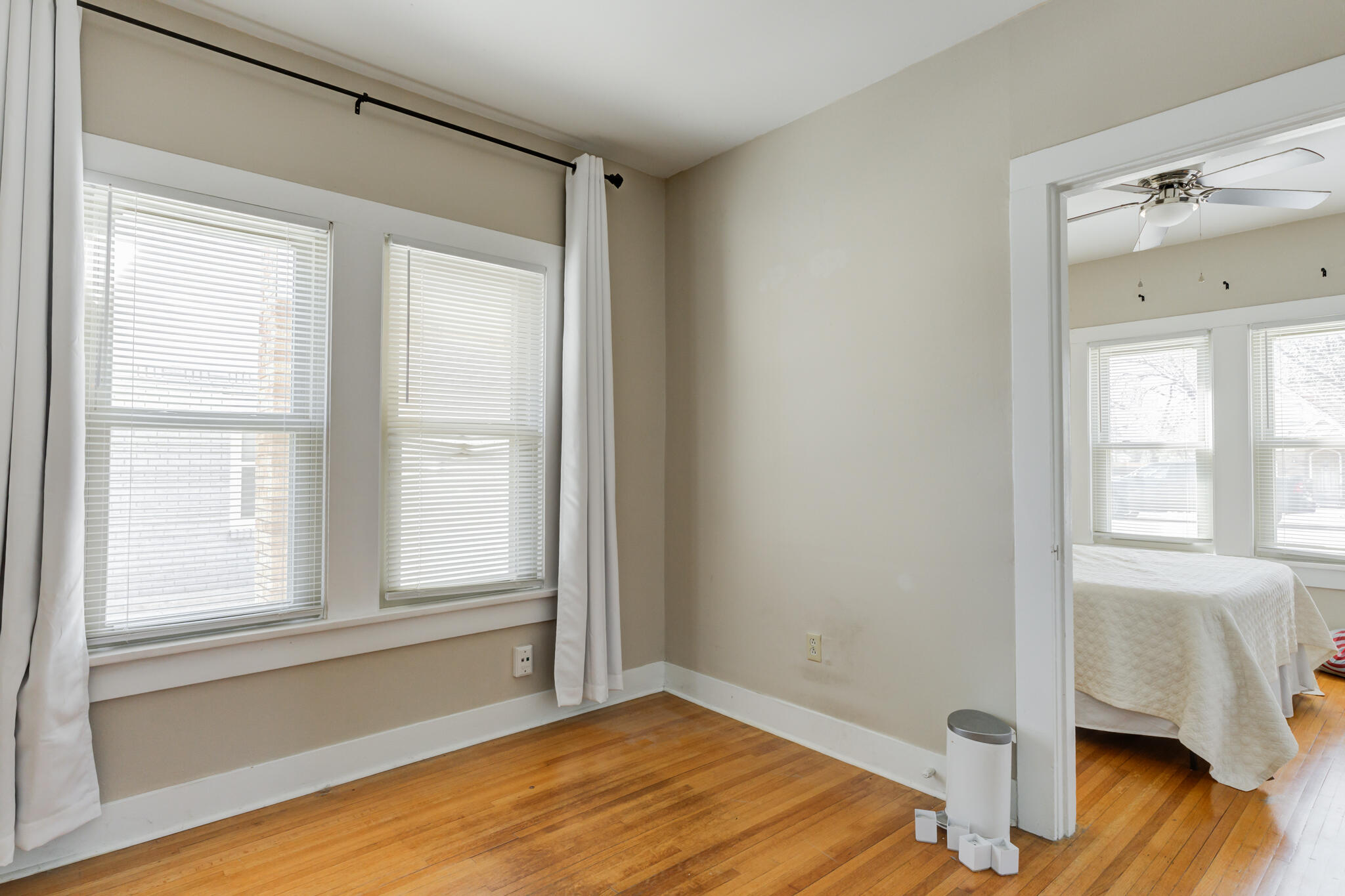 2606 22nd Street Lubbock, TX 79410 - Photo 18 of 24 a view of an empty room with wooden floor and a window