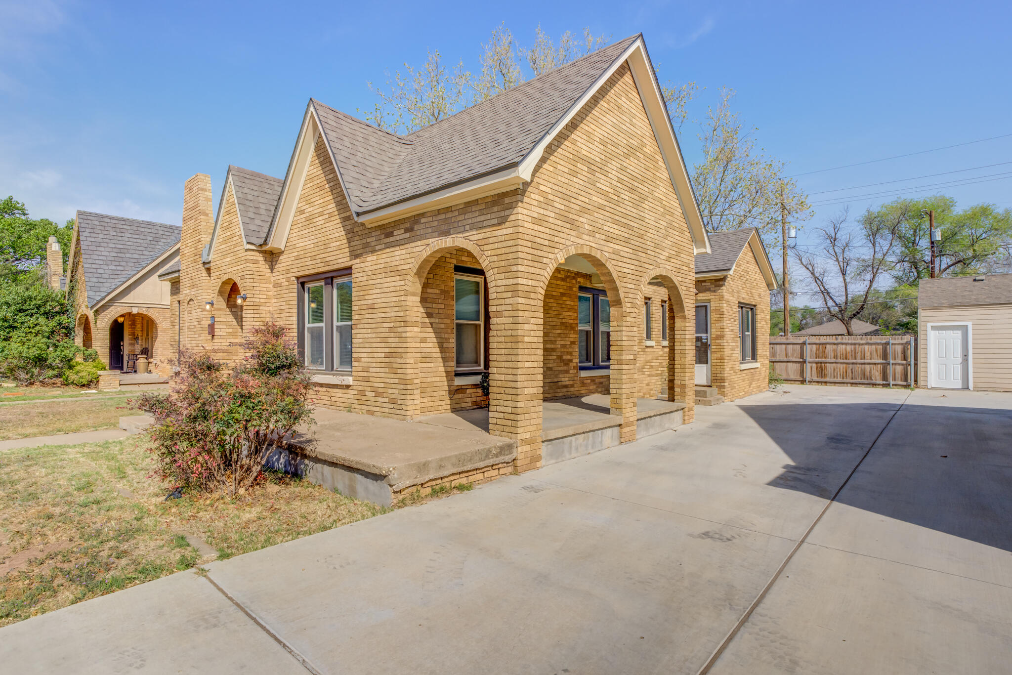 2606 22nd Street Lubbock, TX 79410 - Photo 2 of 24 front view of house with a yard
