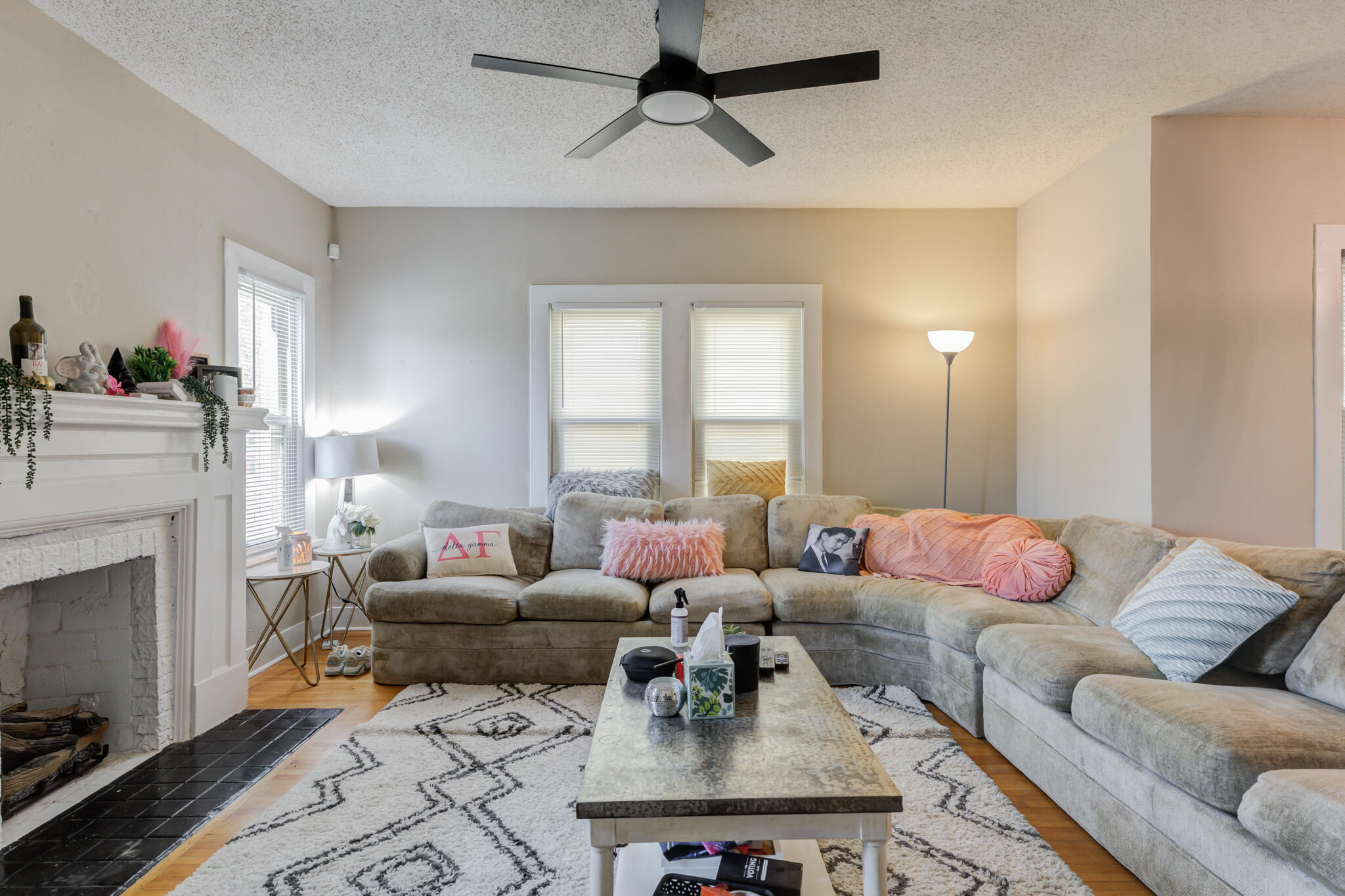 2606 22nd Street Lubbock, TX 79410 - Photo 4 of 24 a living room with furniture and a fireplace