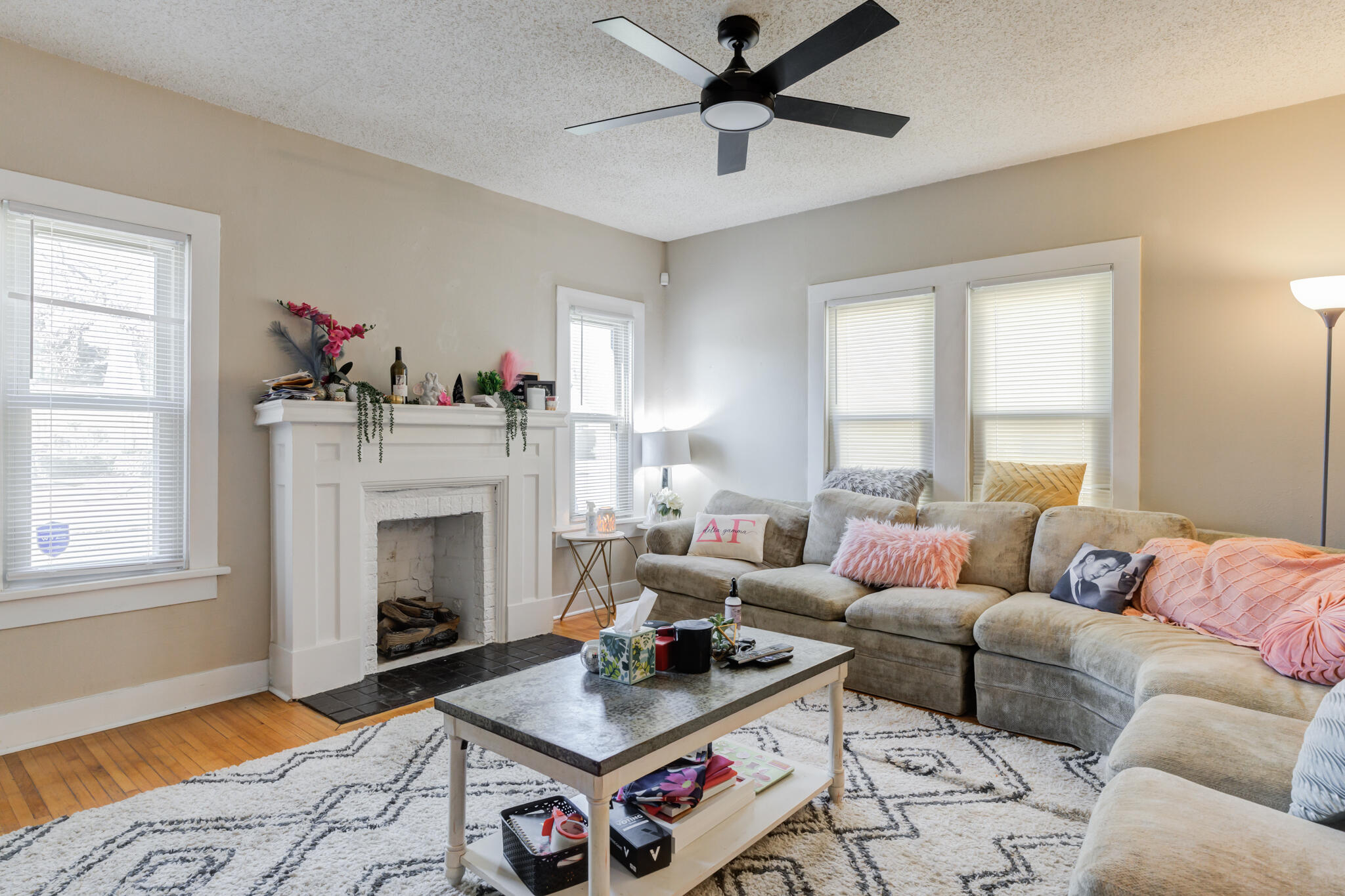 2606 22nd Street Lubbock, TX 79410 - Photo 5 of 24 a living room with furniture and a fireplace