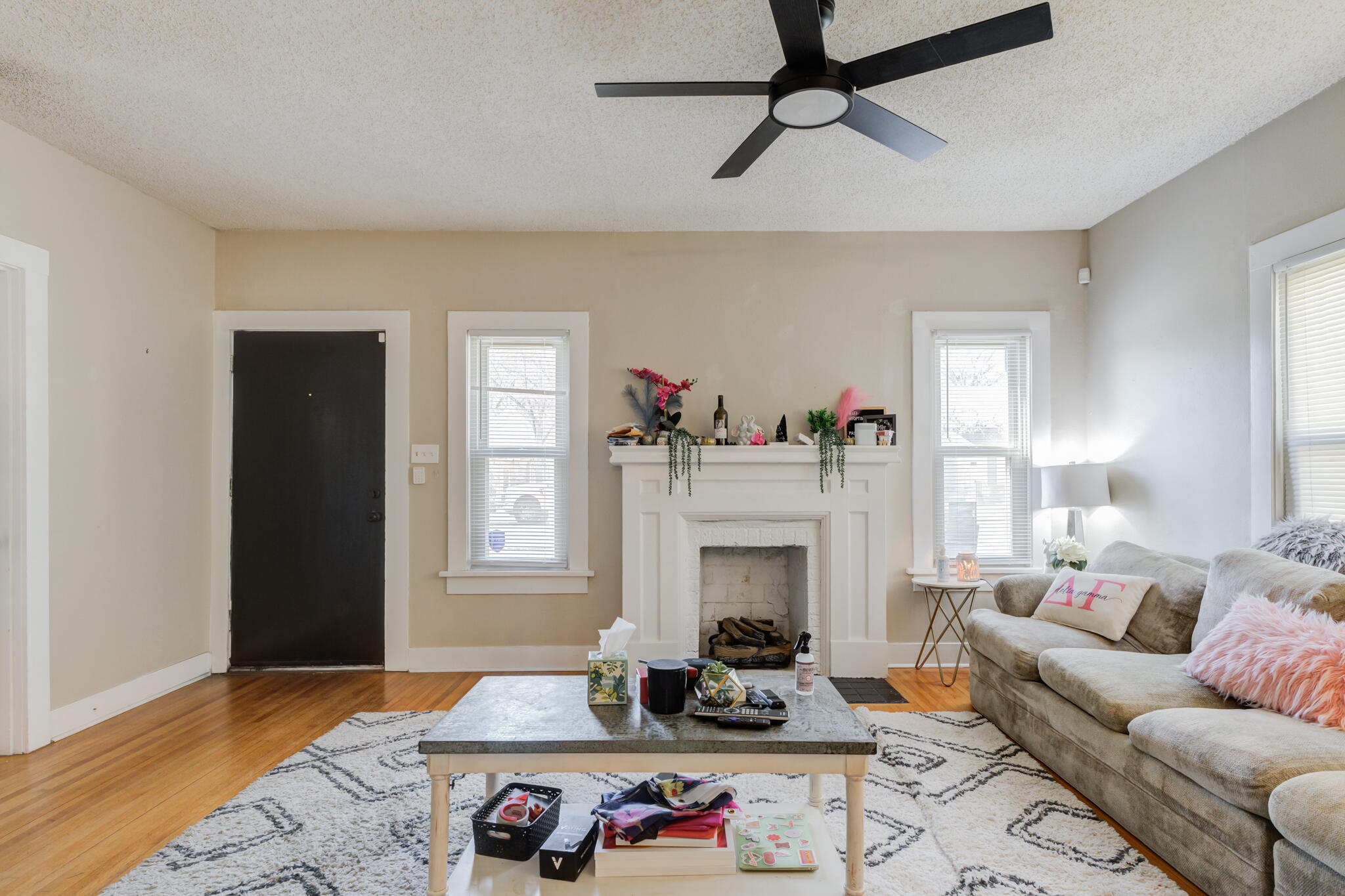 2606 22nd Street Lubbock, TX 79410 - Photo 6 of 24 a living room with furniture and a fireplace