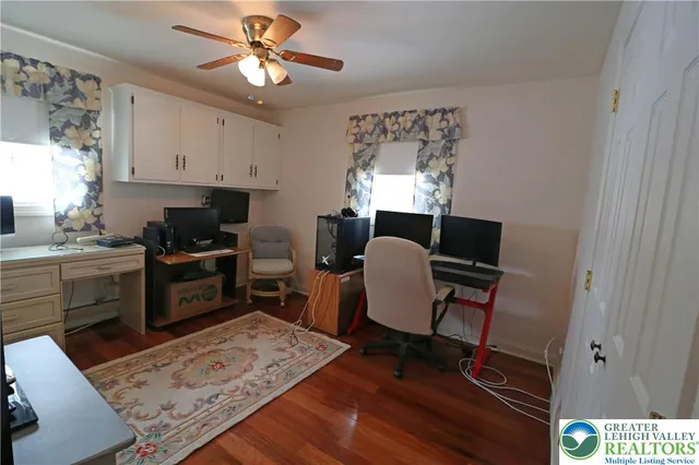 a kitchen with a stove a refrigerator and a coffee table
