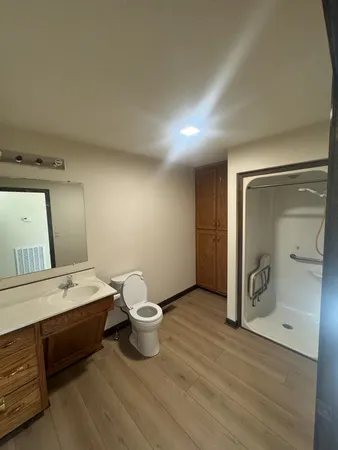 a bathroom with a double vanity sink and mirror