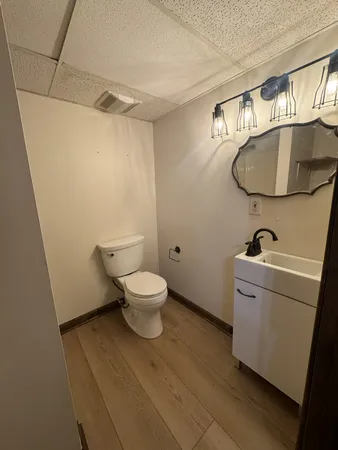 a bathroom with a toilet and a sink