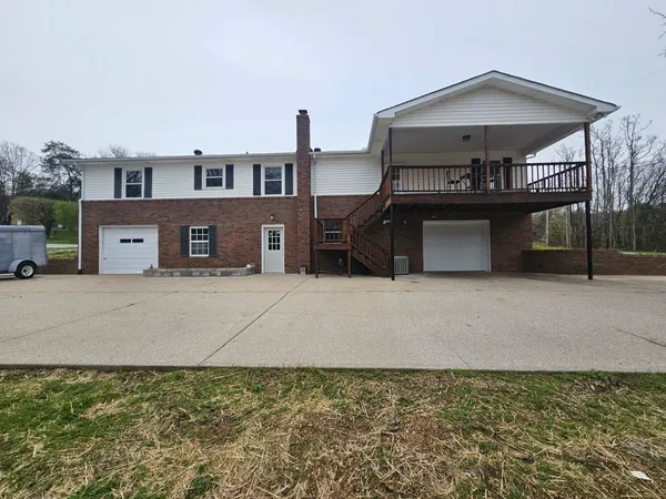 a living room with a bed and a table