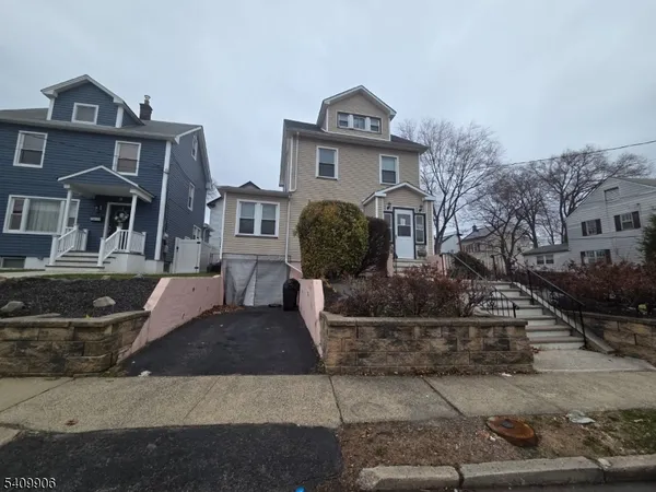 a front view of a house with garage