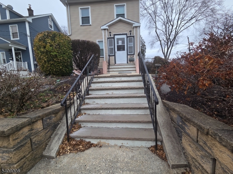 1038 Fairview Place Hillside, NJ 07205 - Photo 2 of 8 a front view of a house with a yard