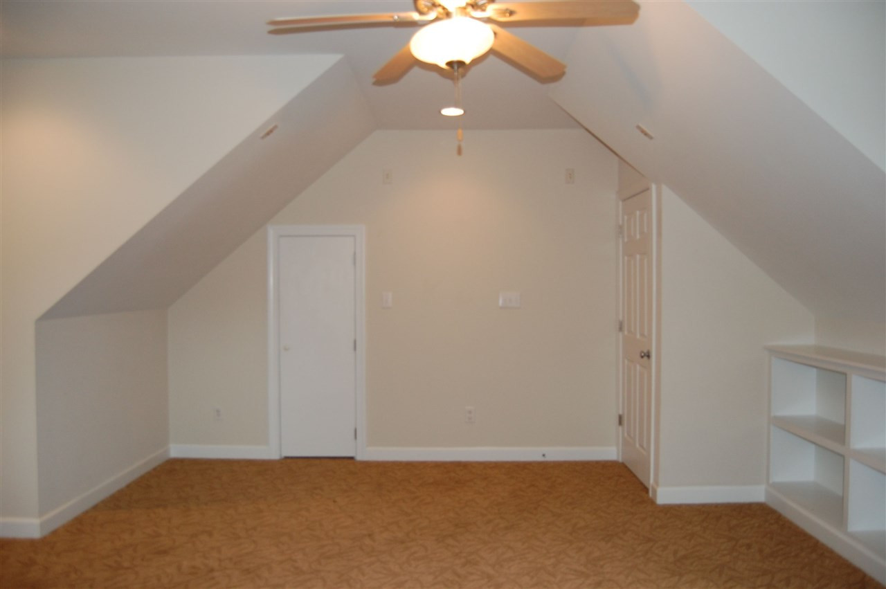 840 Nowell Ridge Road Raleigh, NC 27607 - Photo 20 of 25 View from the other direction, note Walk-In-Closet door to left & shelving to the right, the door is the entry door! Bonus Room
