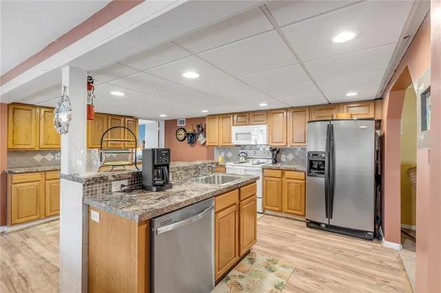 a bed room with a bed and a chandelier