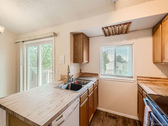 a kitchen that has a cabinets and a stove