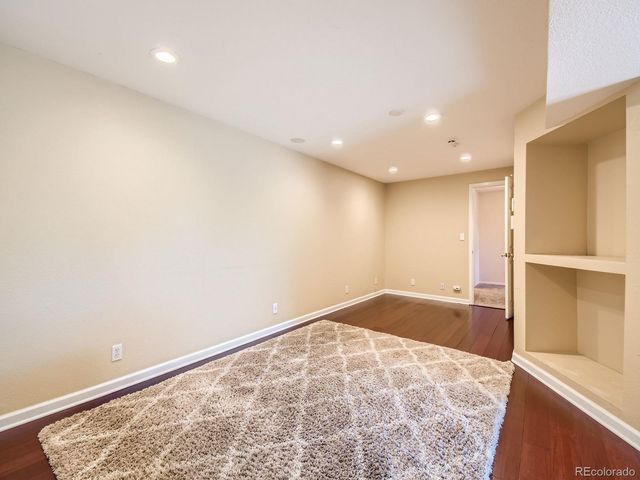 wooden floor in an empty room with a workspace