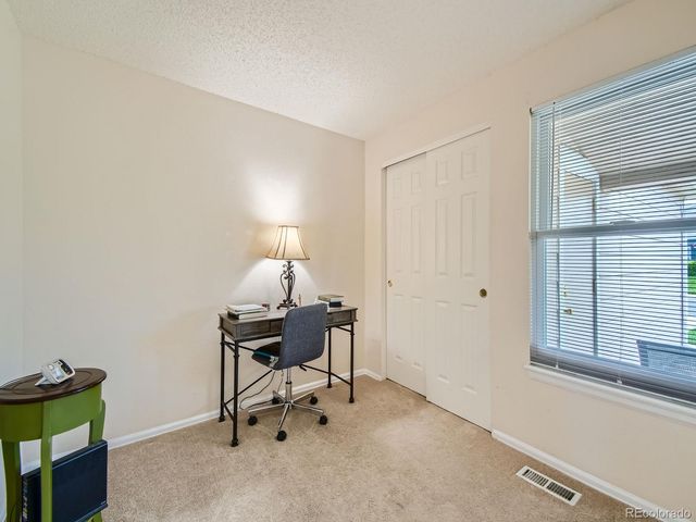 a view of a workspace with furniture