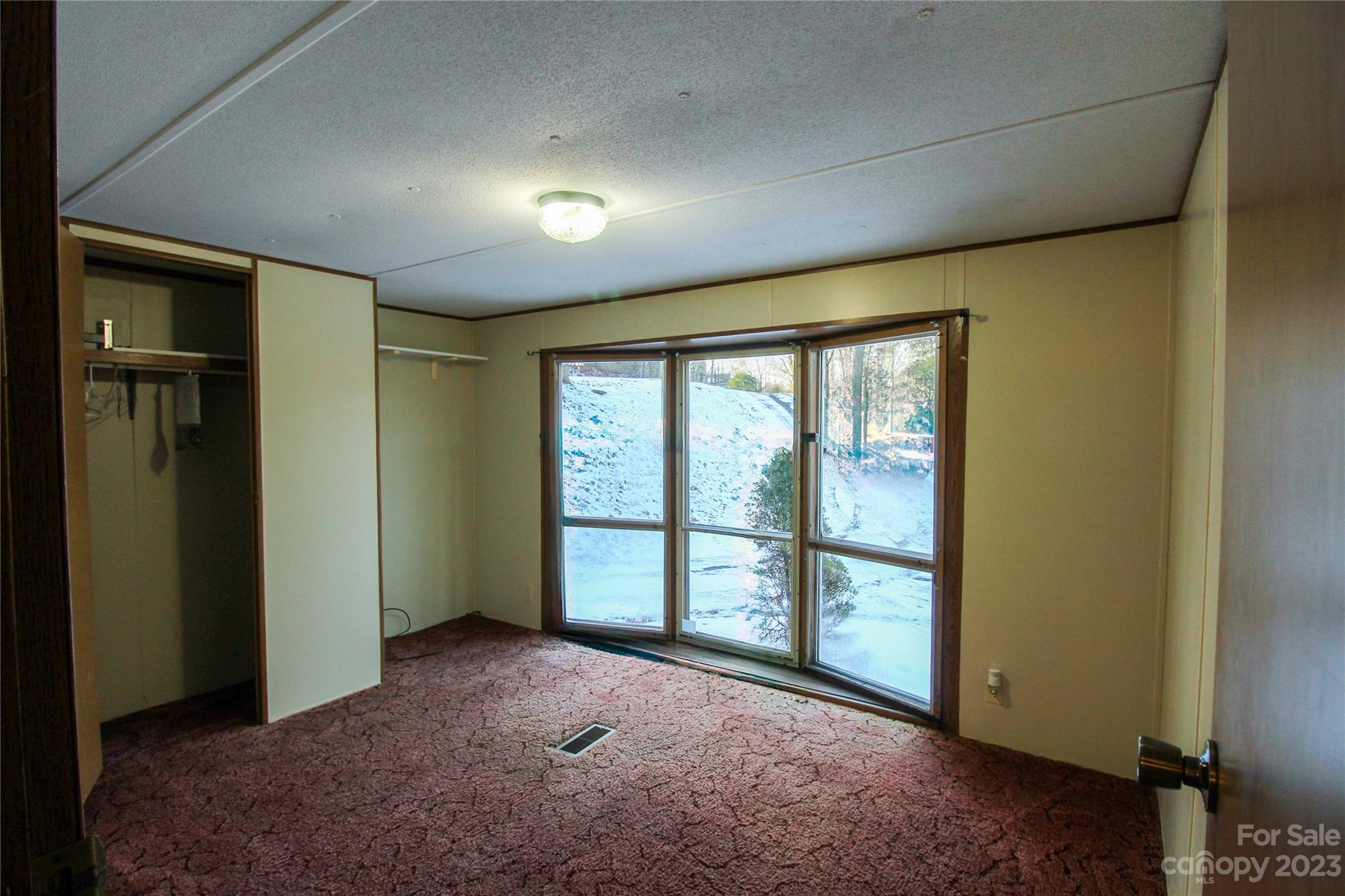591 Pine Run Ridge Spruce Pine, NC 28777 - Photo 13 of 19 an empty room with windows