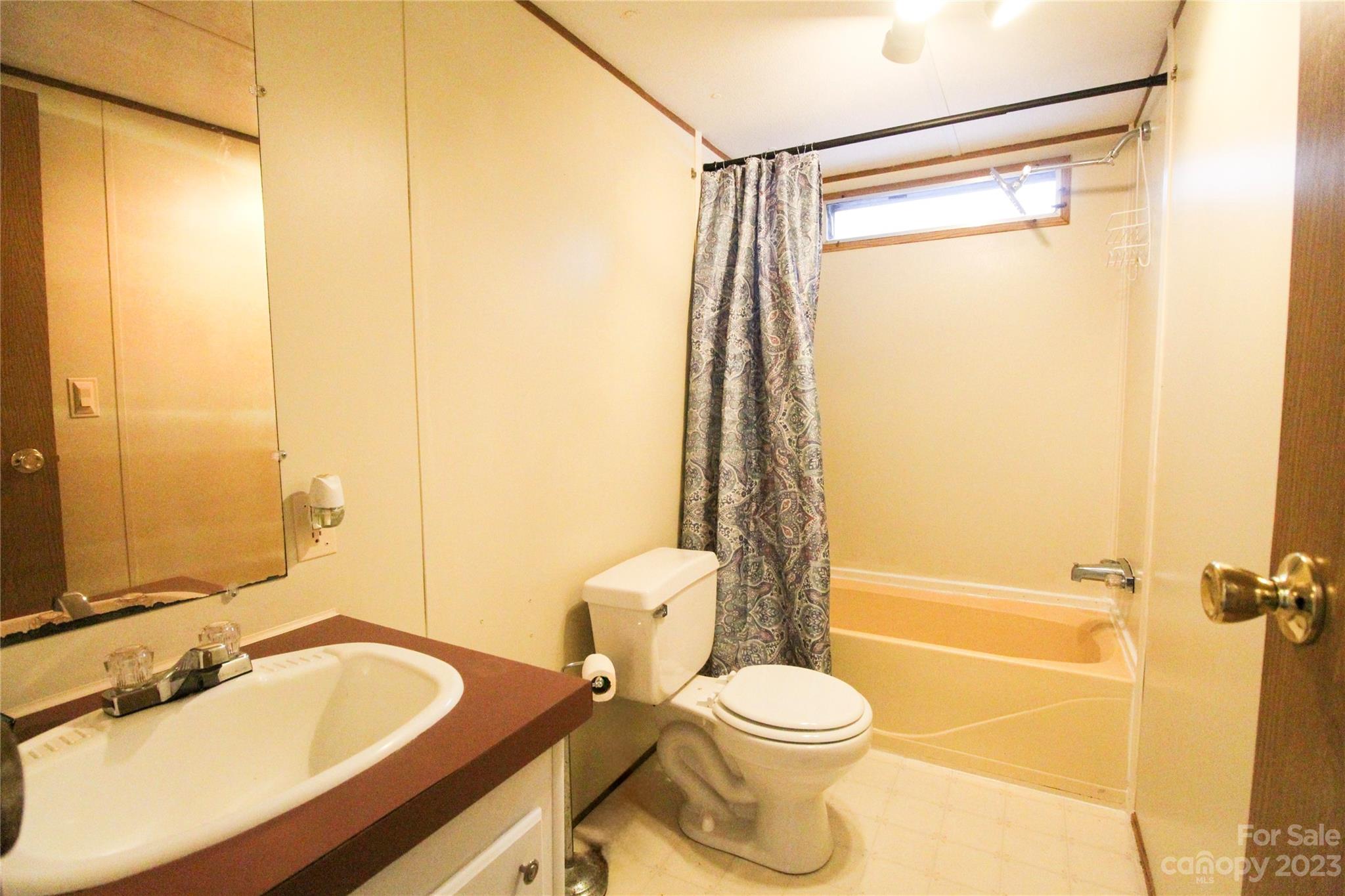 591 Pine Run Ridge Spruce Pine, NC 28777 - Photo 14 of 19 a bathroom with a granite countertop toilet sink and shower