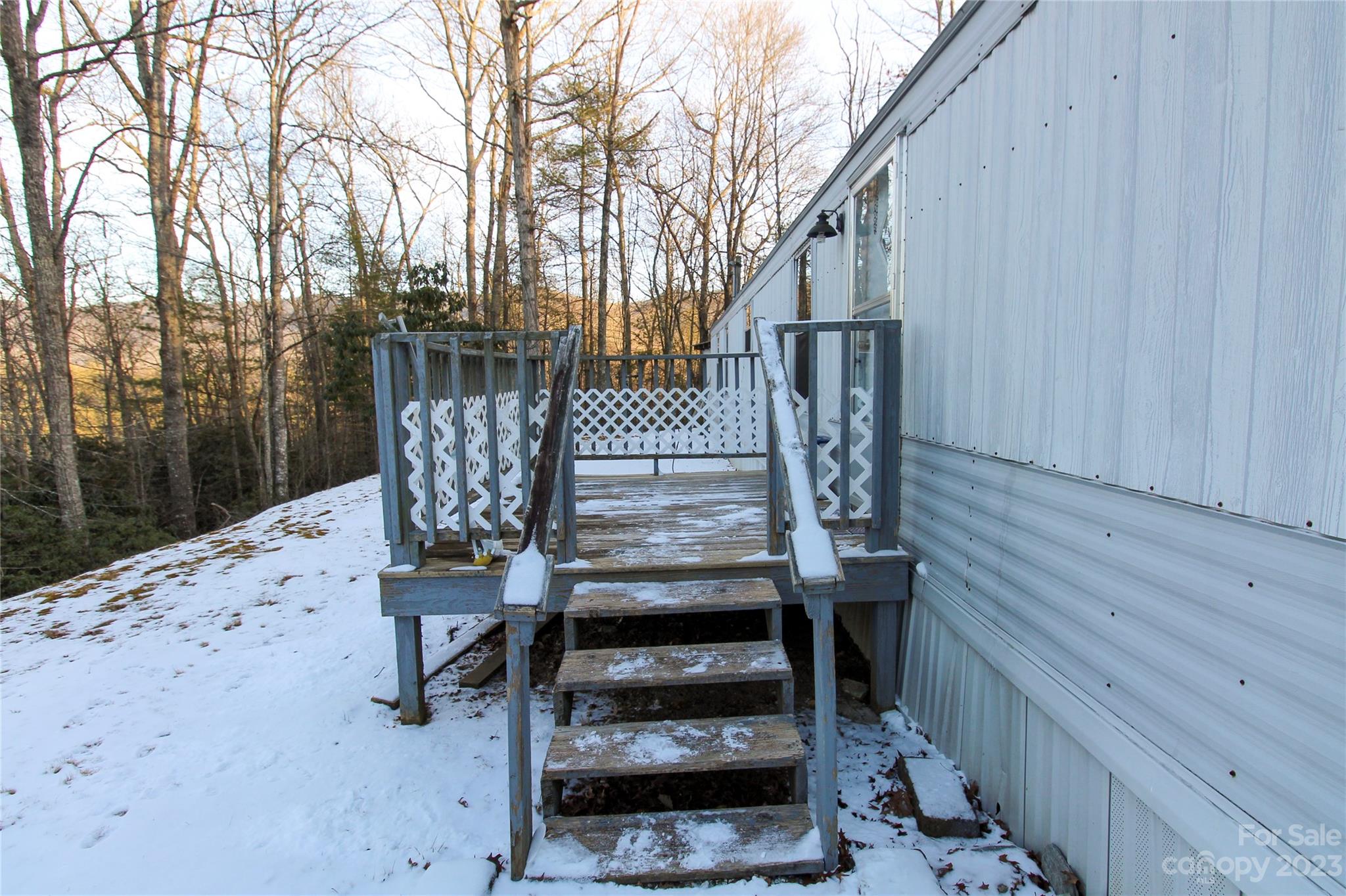 591 Pine Run Ridge Spruce Pine, NC 28777 - Photo 15 of 19 a view of balcony with wooden floor and outdoor seating