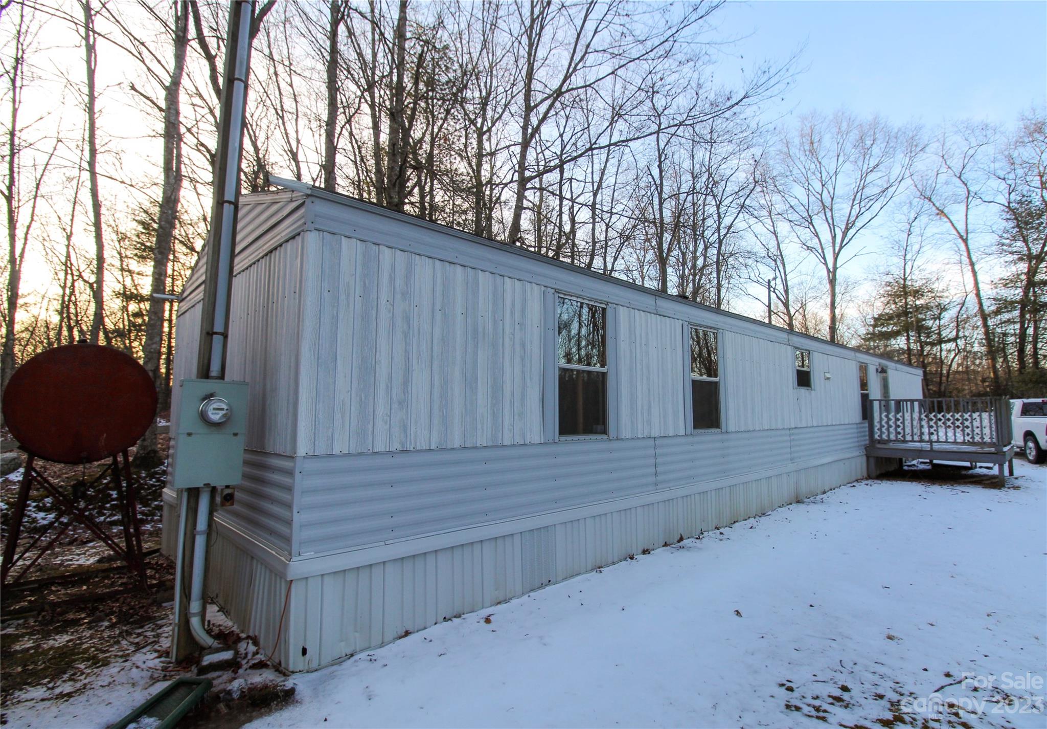591 Pine Run Ridge Spruce Pine, NC 28777 - Photo 18 of 19 a view of a house with a back yard