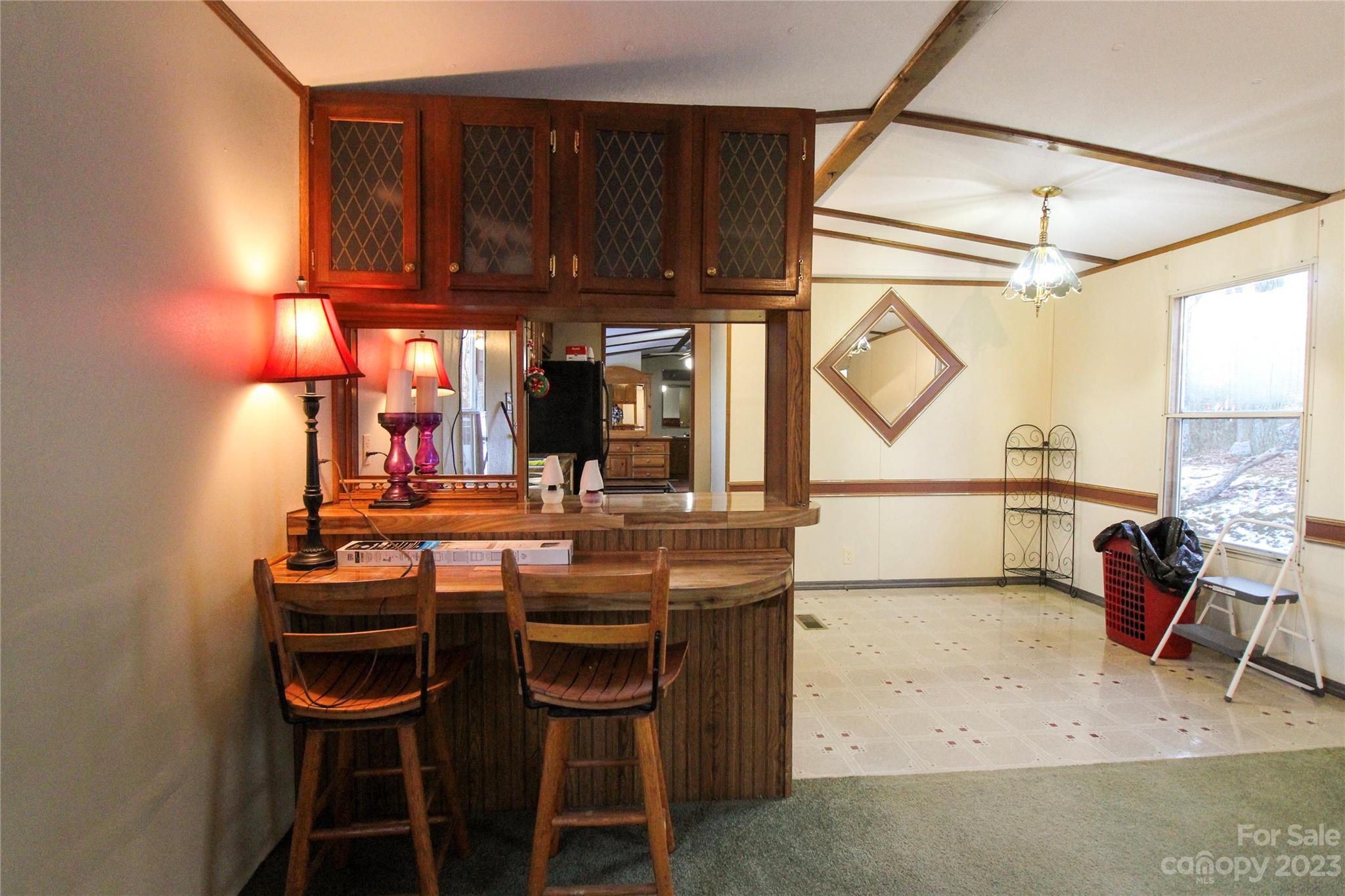 591 Pine Run Ridge Spruce Pine, NC 28777 - Photo 2 of 19 a view of a dining room with furniture and a window
