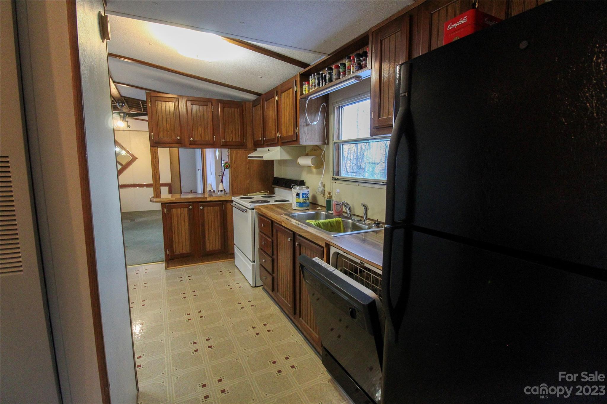 591 Pine Run Ridge Spruce Pine, NC 28777 - Photo 5 of 19 a kitchen with stainless steel appliances granite countertop a refrigerator and a stove