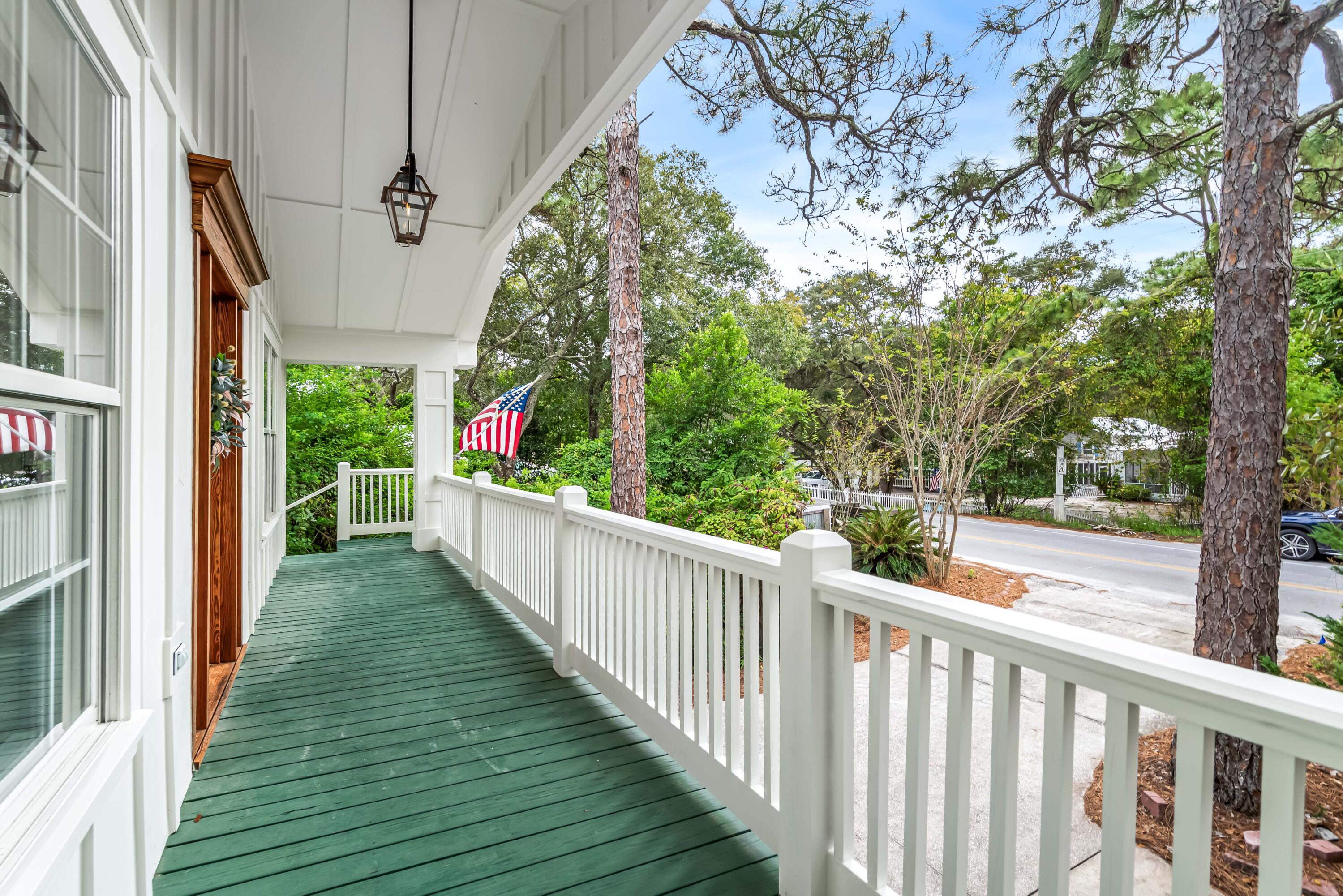 345 Defuniak Street Santa Rosa Beach, FL 32459 - Photo 16 of 52 a view of a balcony with wooden floor