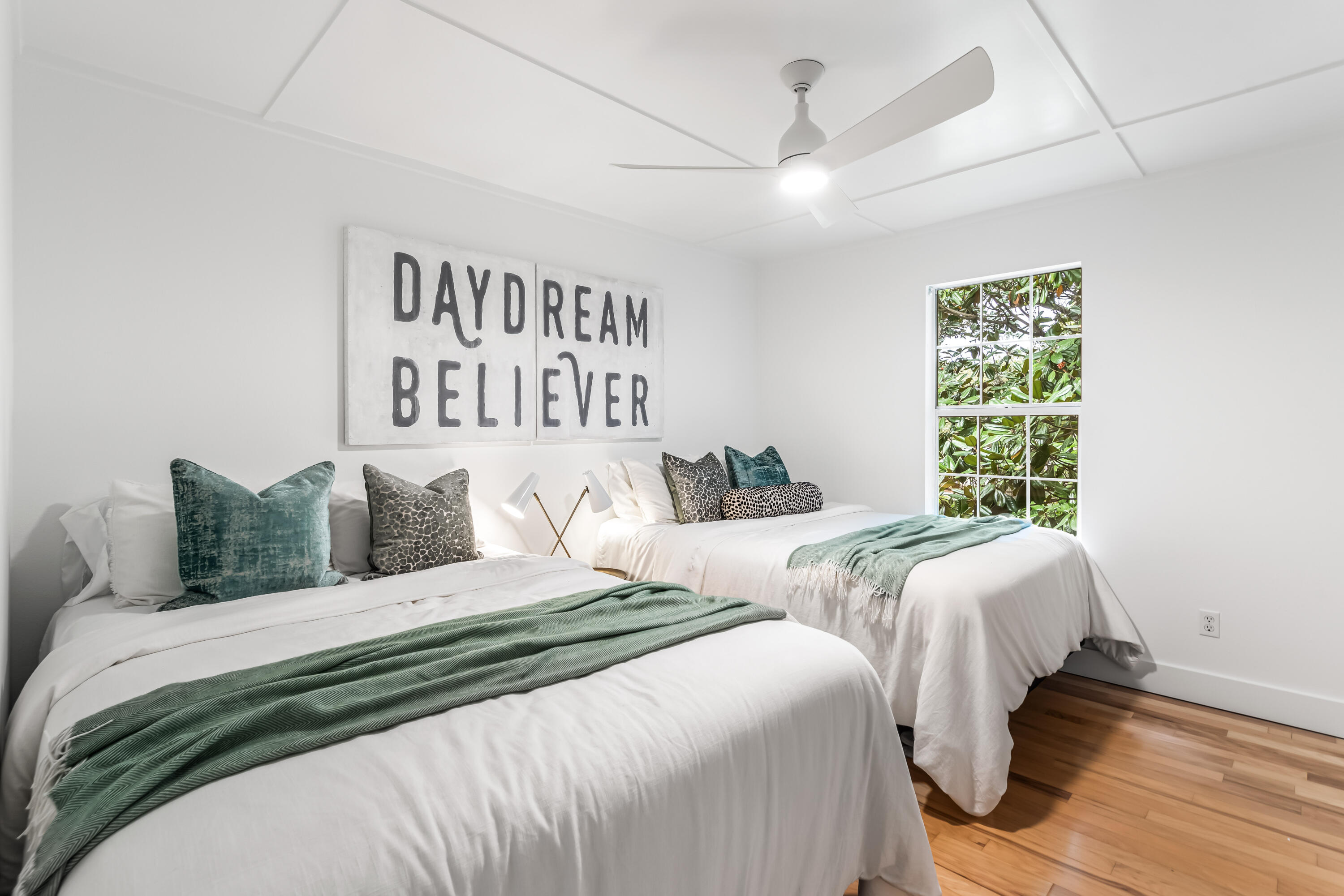 345 Defuniak Street Santa Rosa Beach, FL 32459 - Photo 18 of 52 a bedroom with two beds and a window